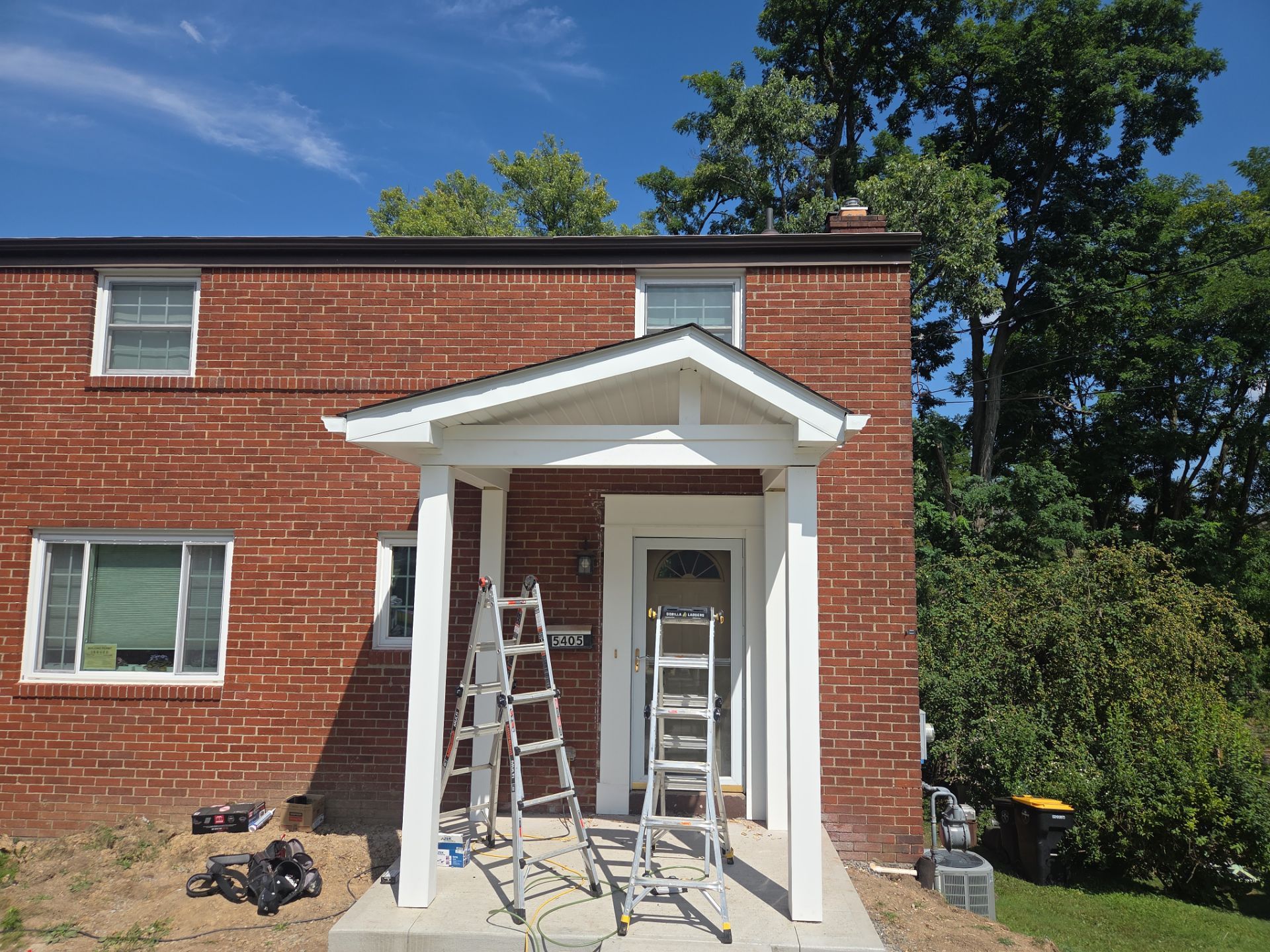 Concret and roof build  by Cousins Roofing Siding & Decks