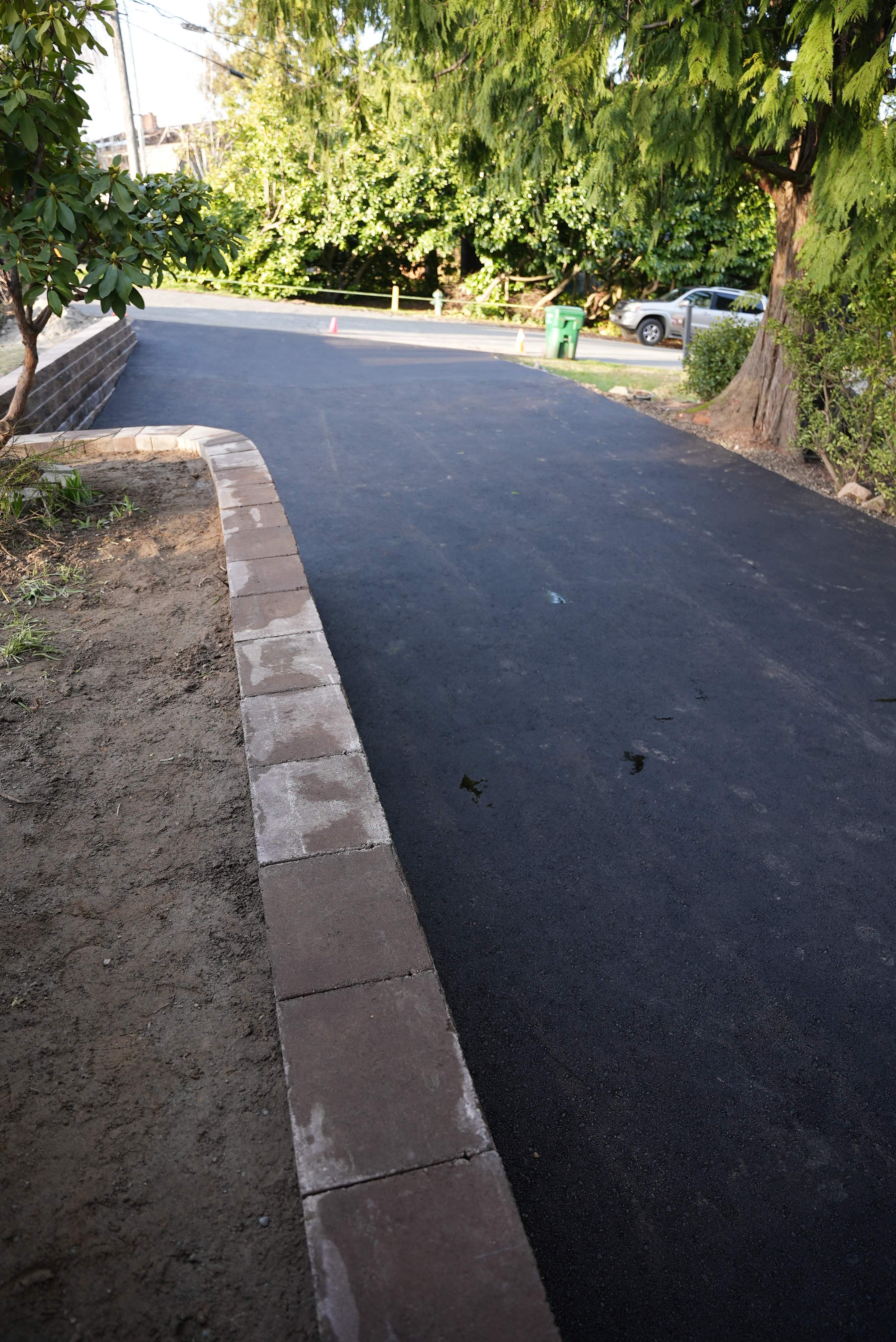 Lorra | Asphalt Driveway Repair & Retaining Wall by Jireh Asphalt & Concrete Inc 