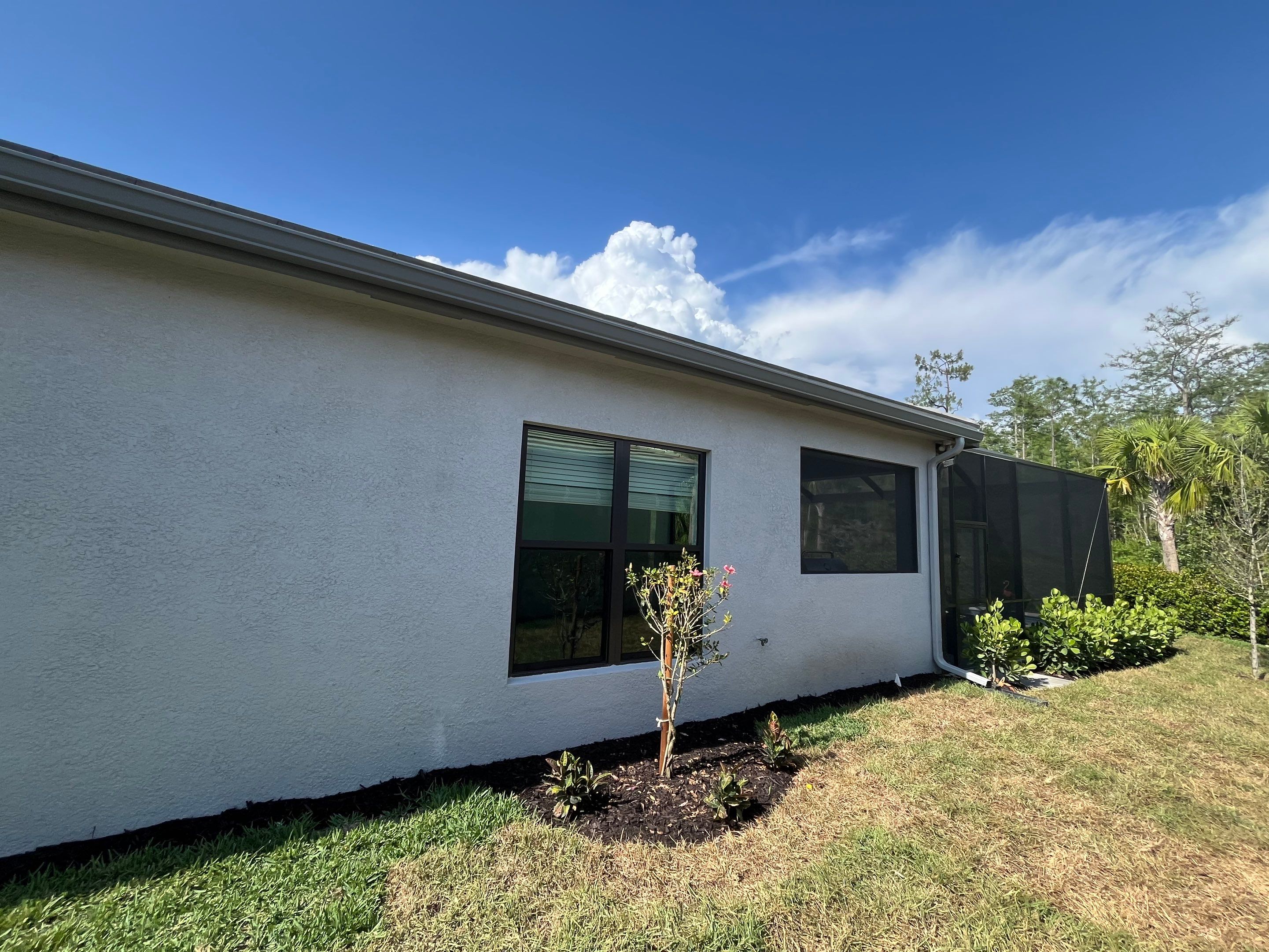 Grey Seamless Gutter Installation in Estero FL by Gutter Professors