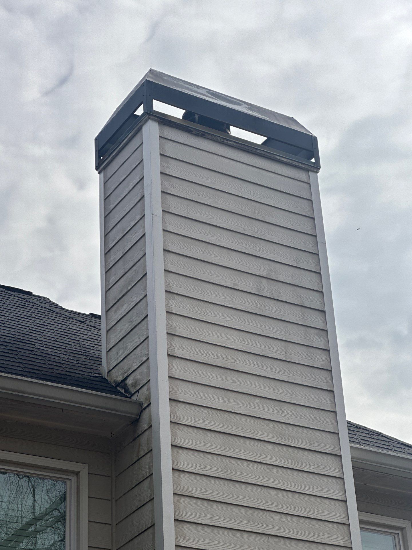 Marietta, GA Chimney Siding, Fascia, and Soffit Replacement using James Hardie Lap Siding, Hardie Trim, and Hardie Panel by Nelson Exteriors 