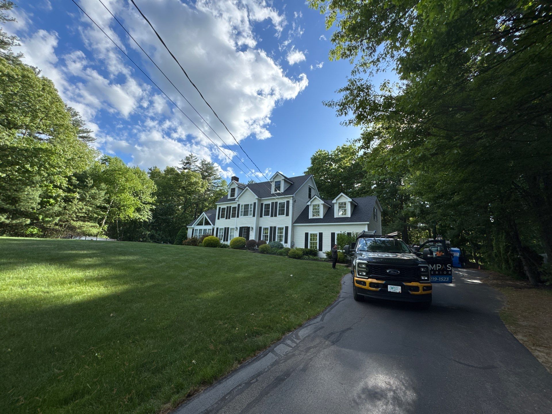 Roof Replacement on Cobbetts Pond in Windham, NH with Owens Corning Onyx Black Shingles by Compass exteriors