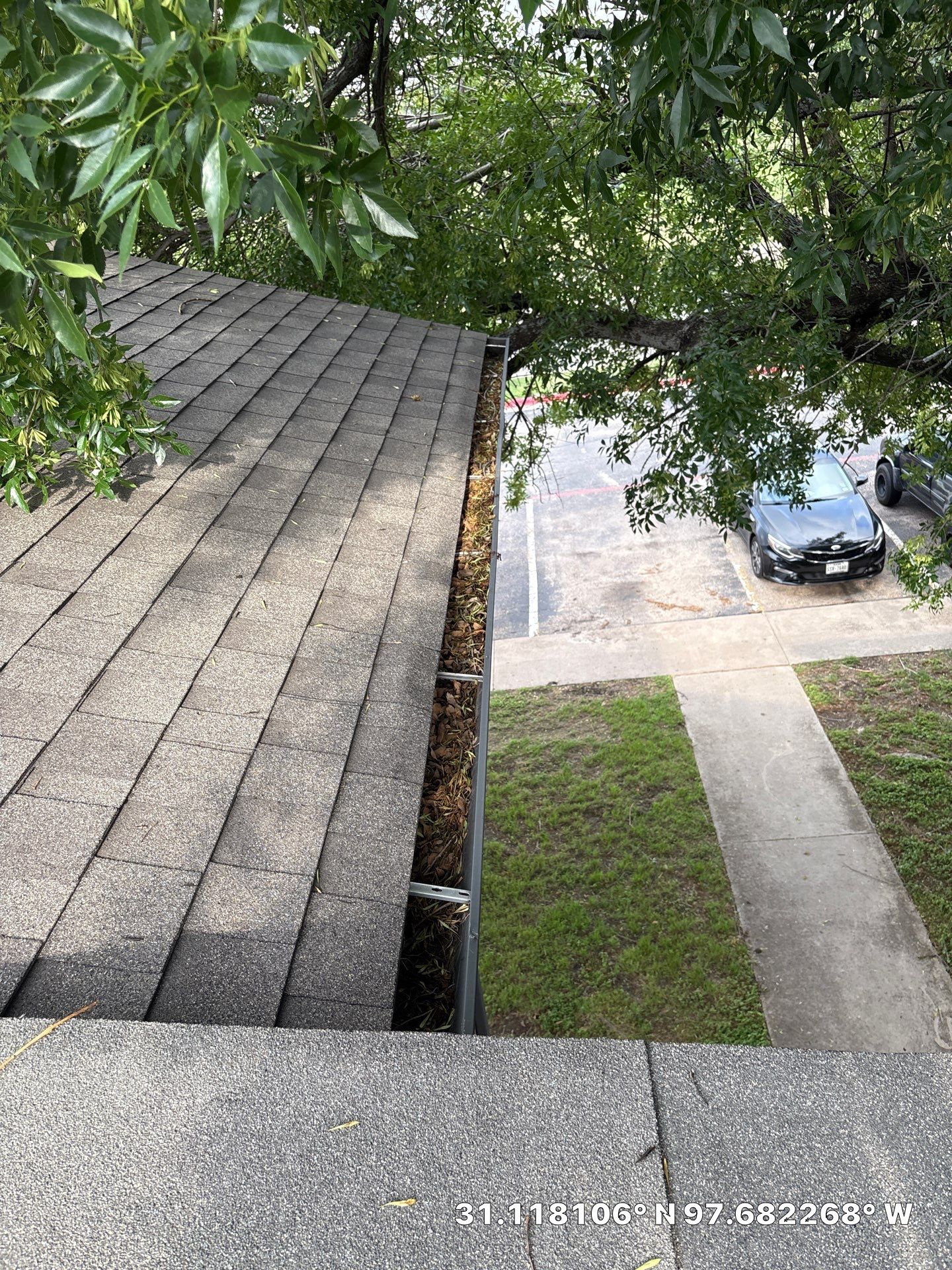Commercial gutter cleaning Killeen & Temple before photo with filled gutters