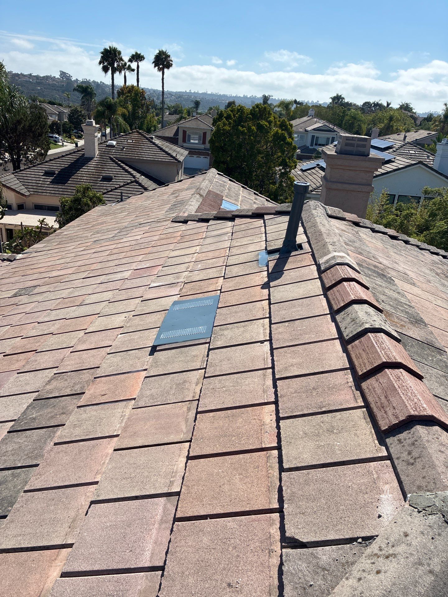 Carlsbad Concrete Tile Roof Replacement with Copper Flashing and Skylights by Reliable Roofing San Diego Inc.