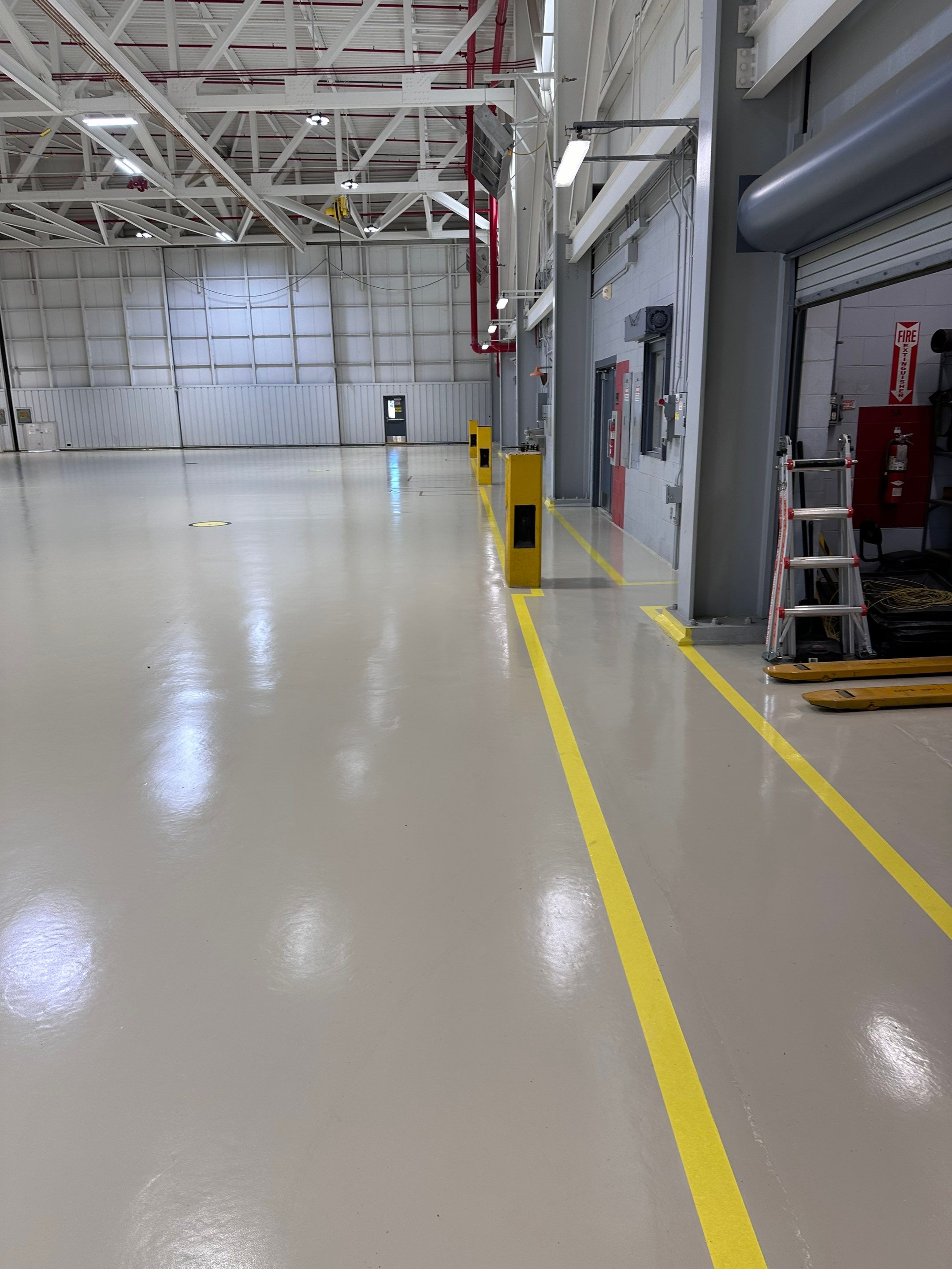 Industrial Epoxy Flooring for Army National Guard Hangar in Mobile by Cornerstone Hard Surface Restoration 