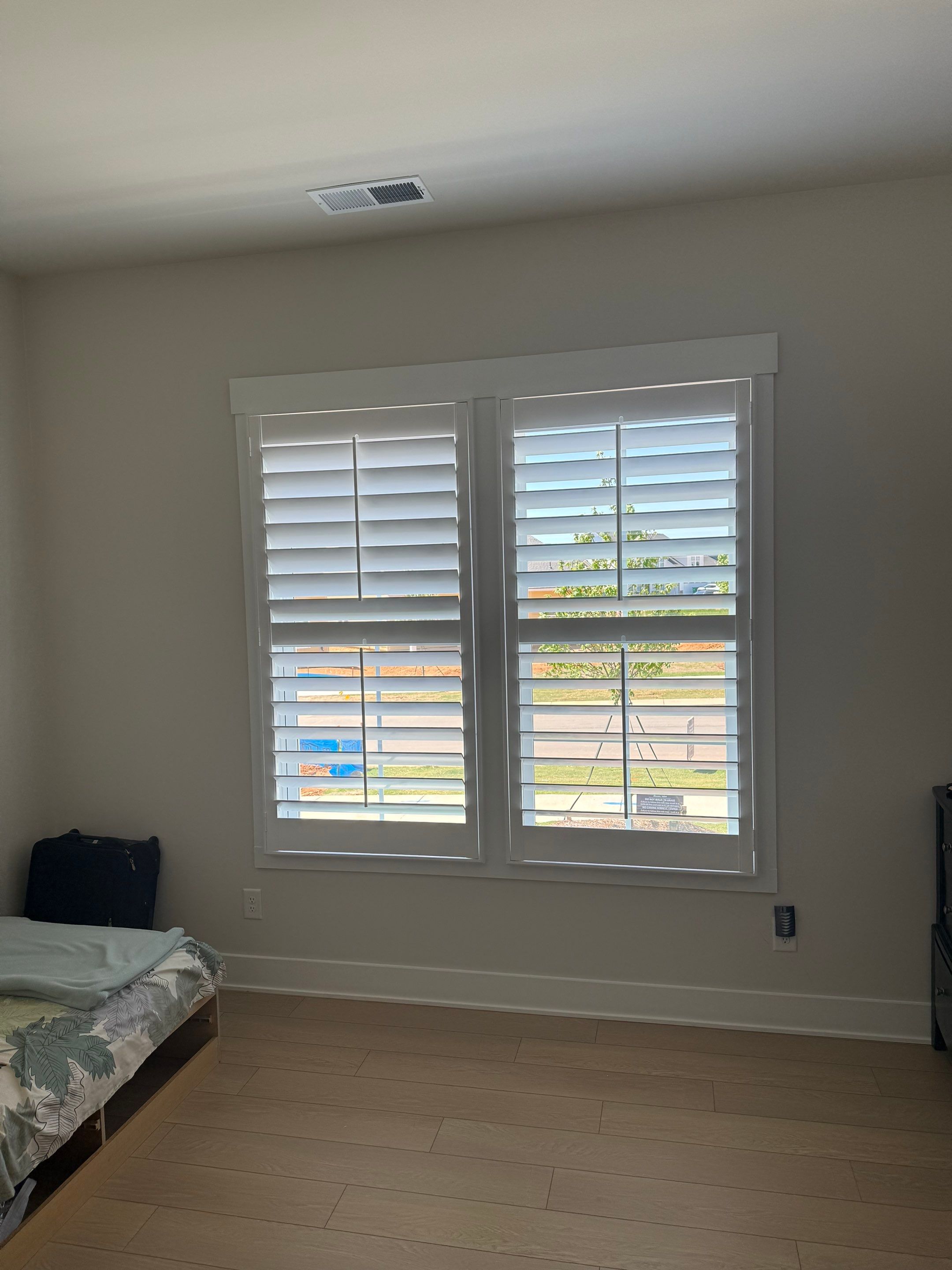 Whole Home Interior Shutter and Roller Shade Installation in Charlotte by Southern Traditions Window Fashions