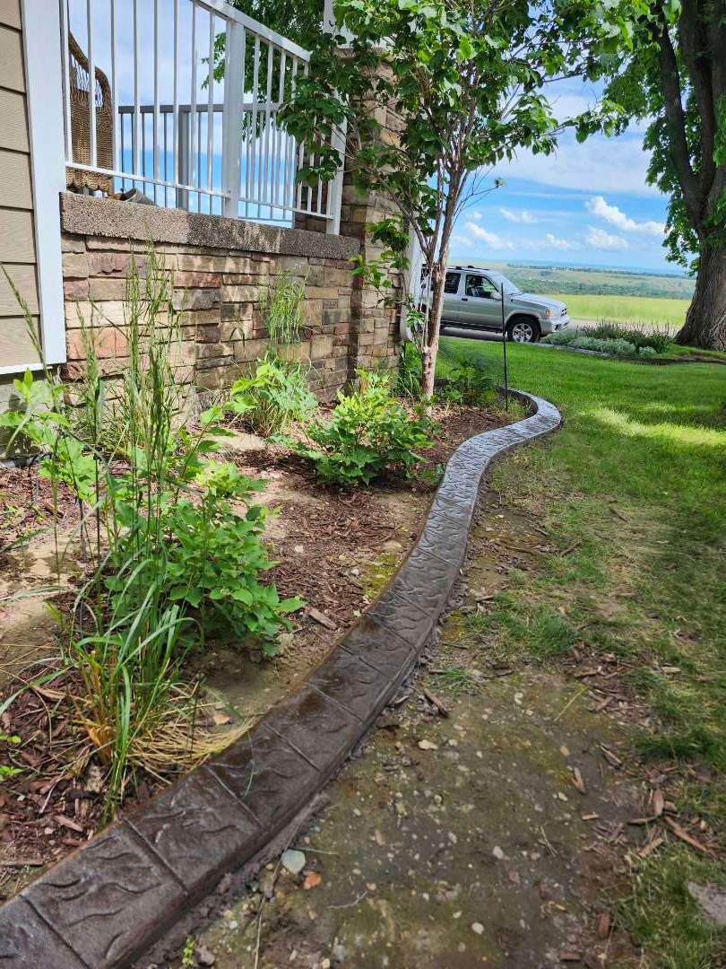 Decorative Stamped Concrete Landscape Edging Installation in Medicine Hat by Pump it Up Concrete Jacking