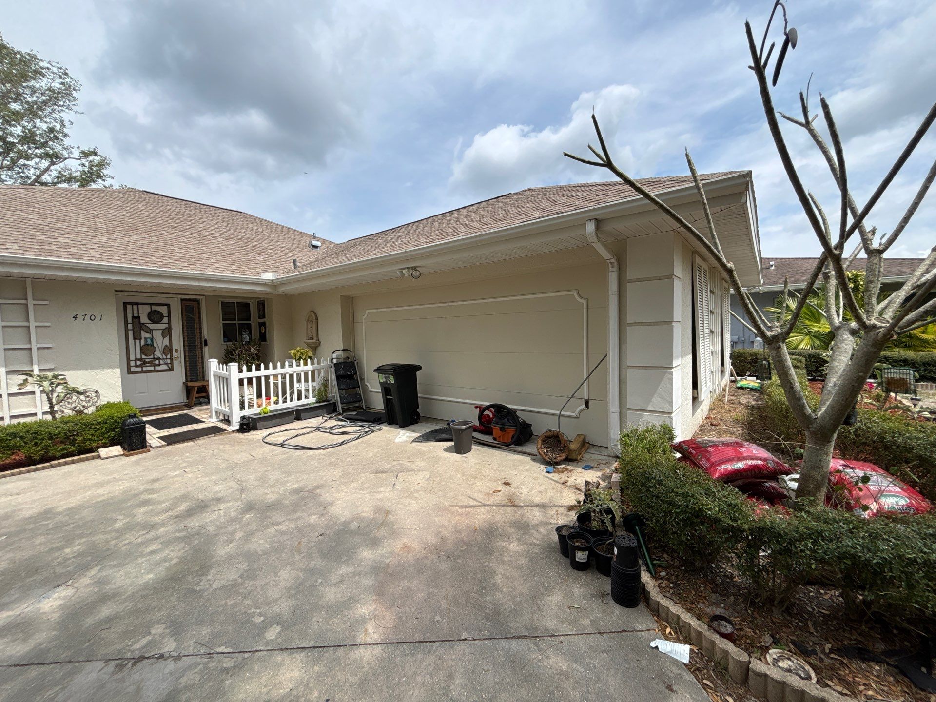Gutter Project with White 6-K Seamless Gutters Installation and Downspouts in Sarasota FL by Gutter Professors