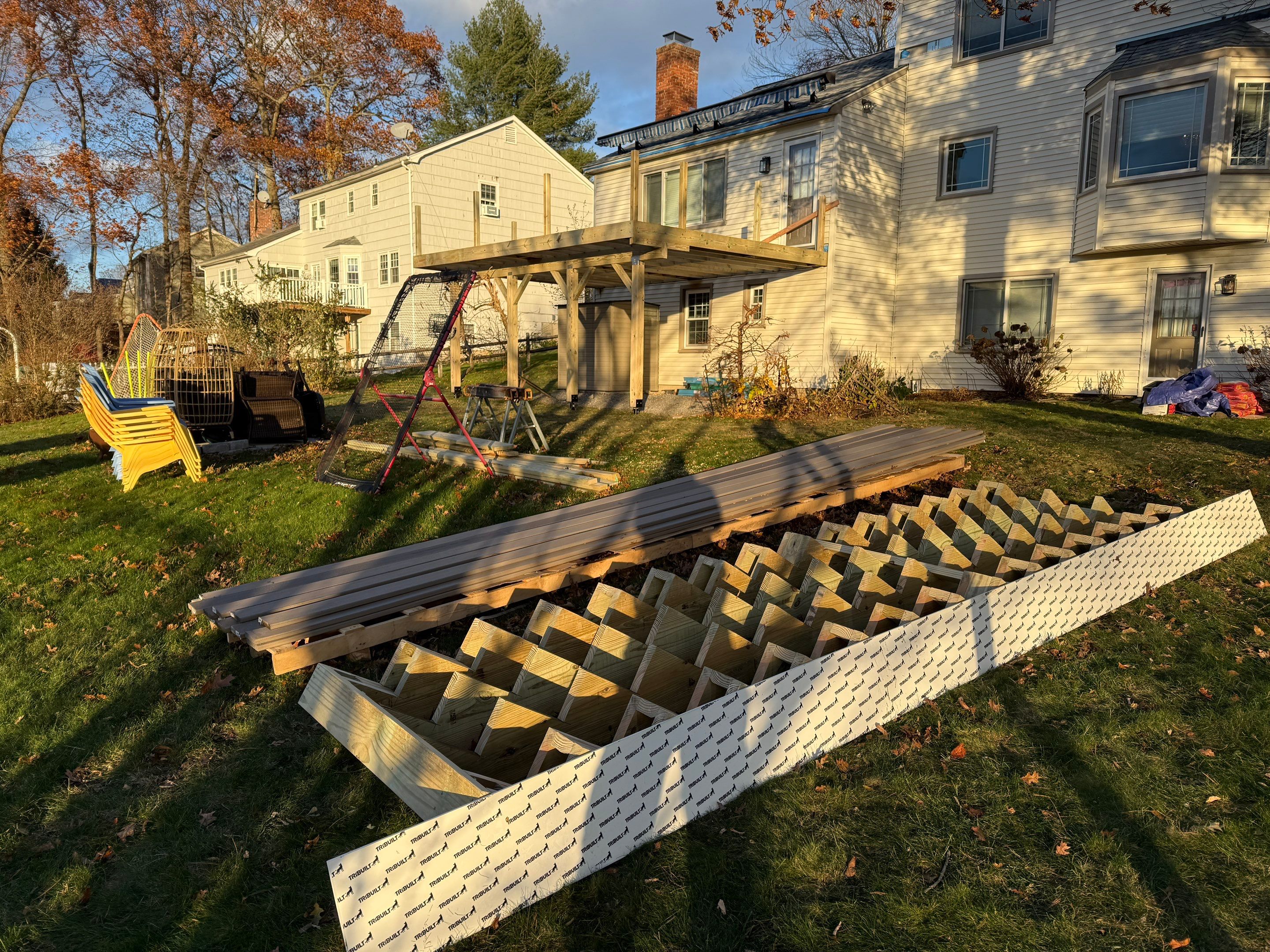 Replacement deck with Trex linage Biscayne boards and White Transcend railing with cocktail rail, and Trex gate. by DiGiorgi Roofing and Siding Inc