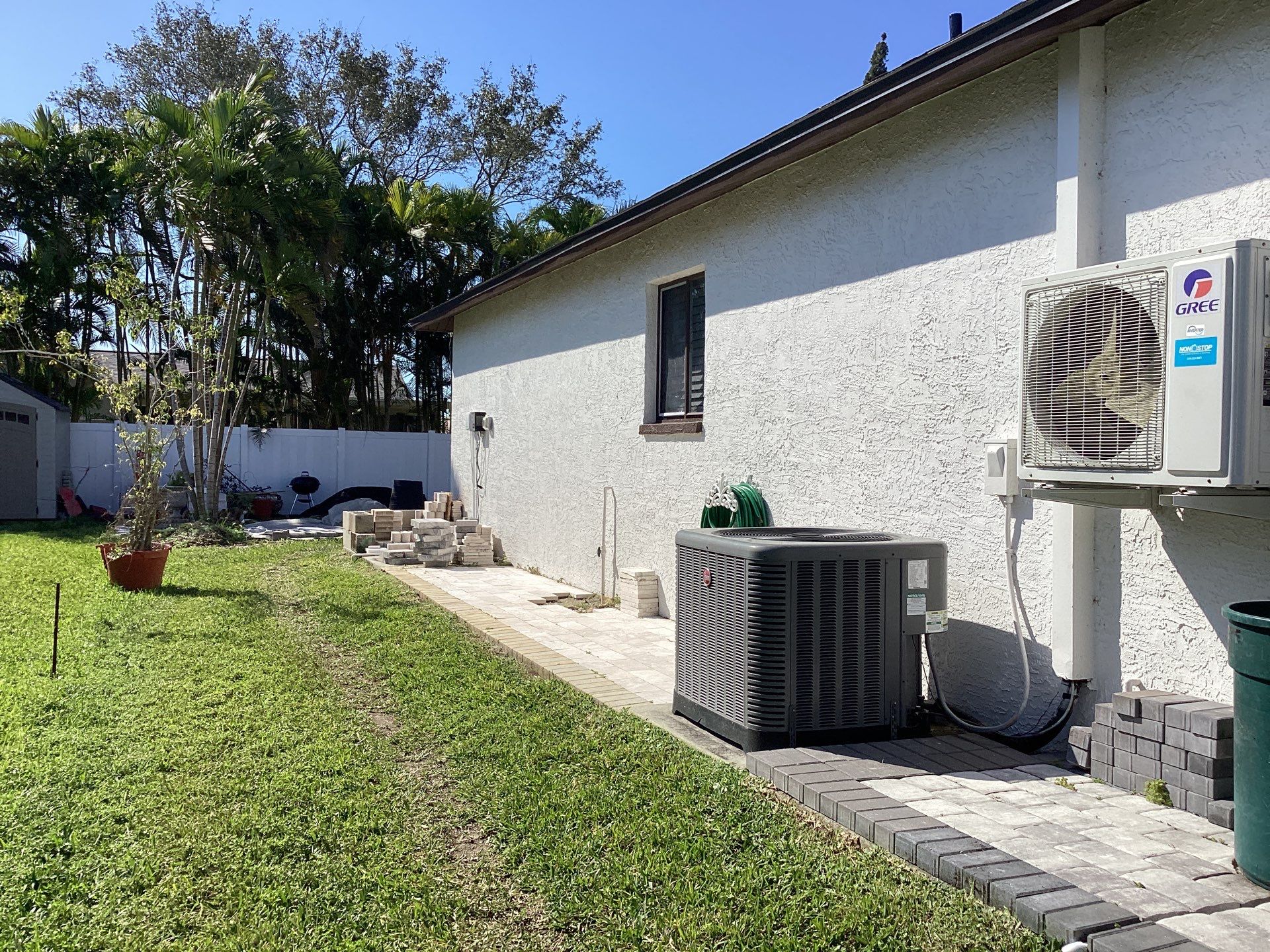 Brown Gutter + White and Brown Downspouts in Cape Coral FL by Gutter Professors