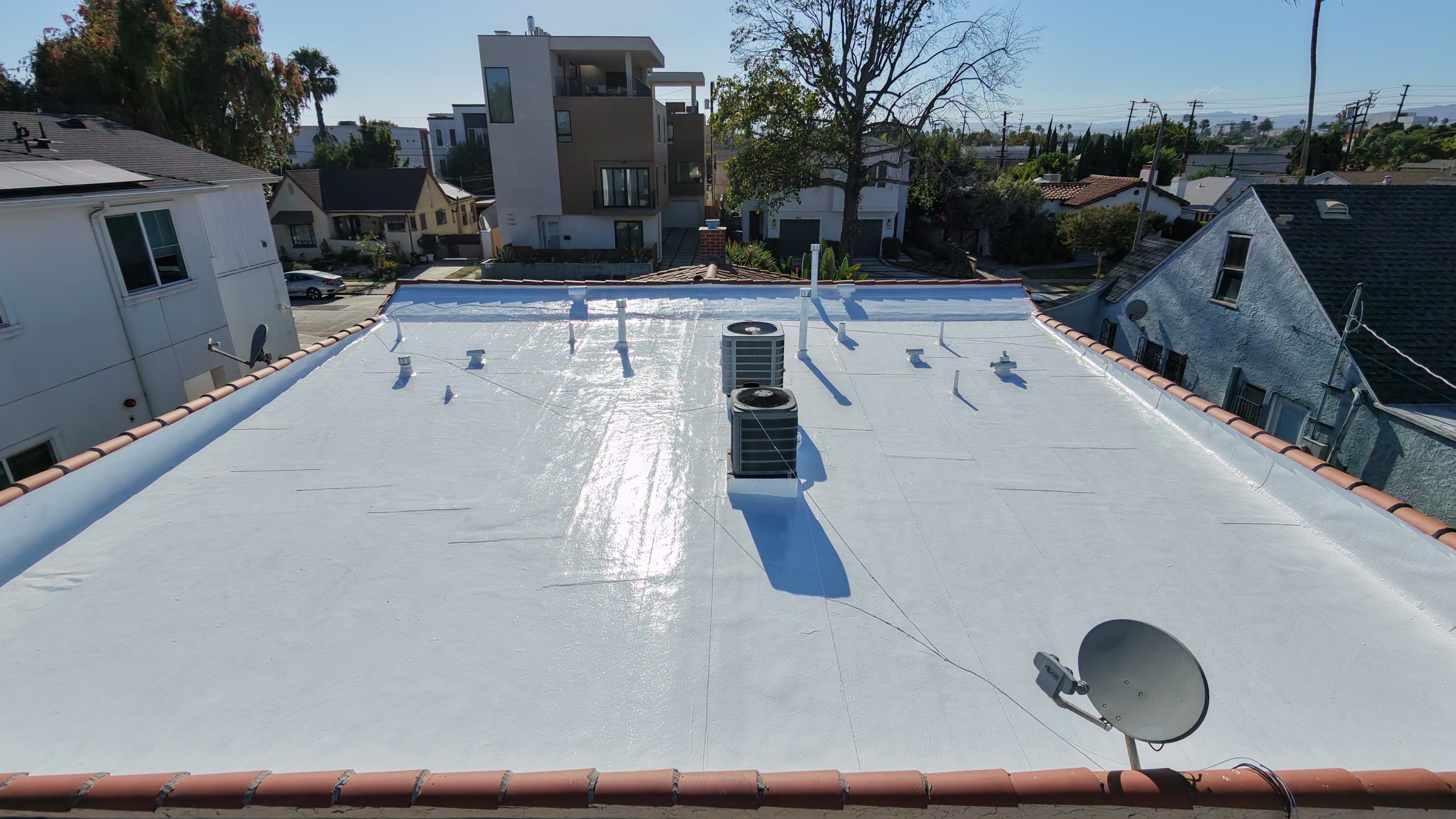 Los Angeles Flat Roof Restoration with White Reflective Coating by Hull Brothers Roofing