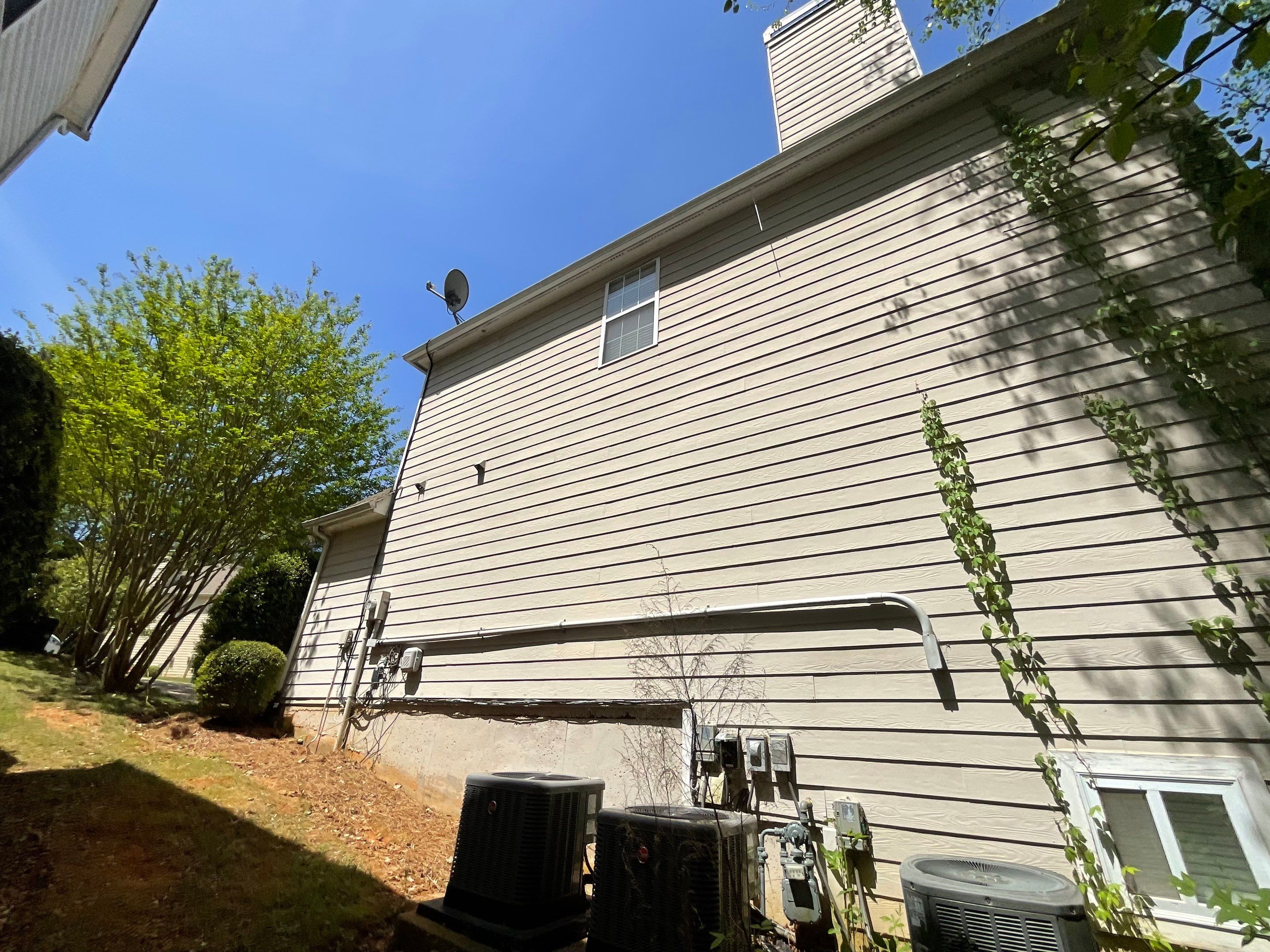 Stucco and Siding Exterior Painting with New Gutters in Kennesaw by Swift Home Renovations