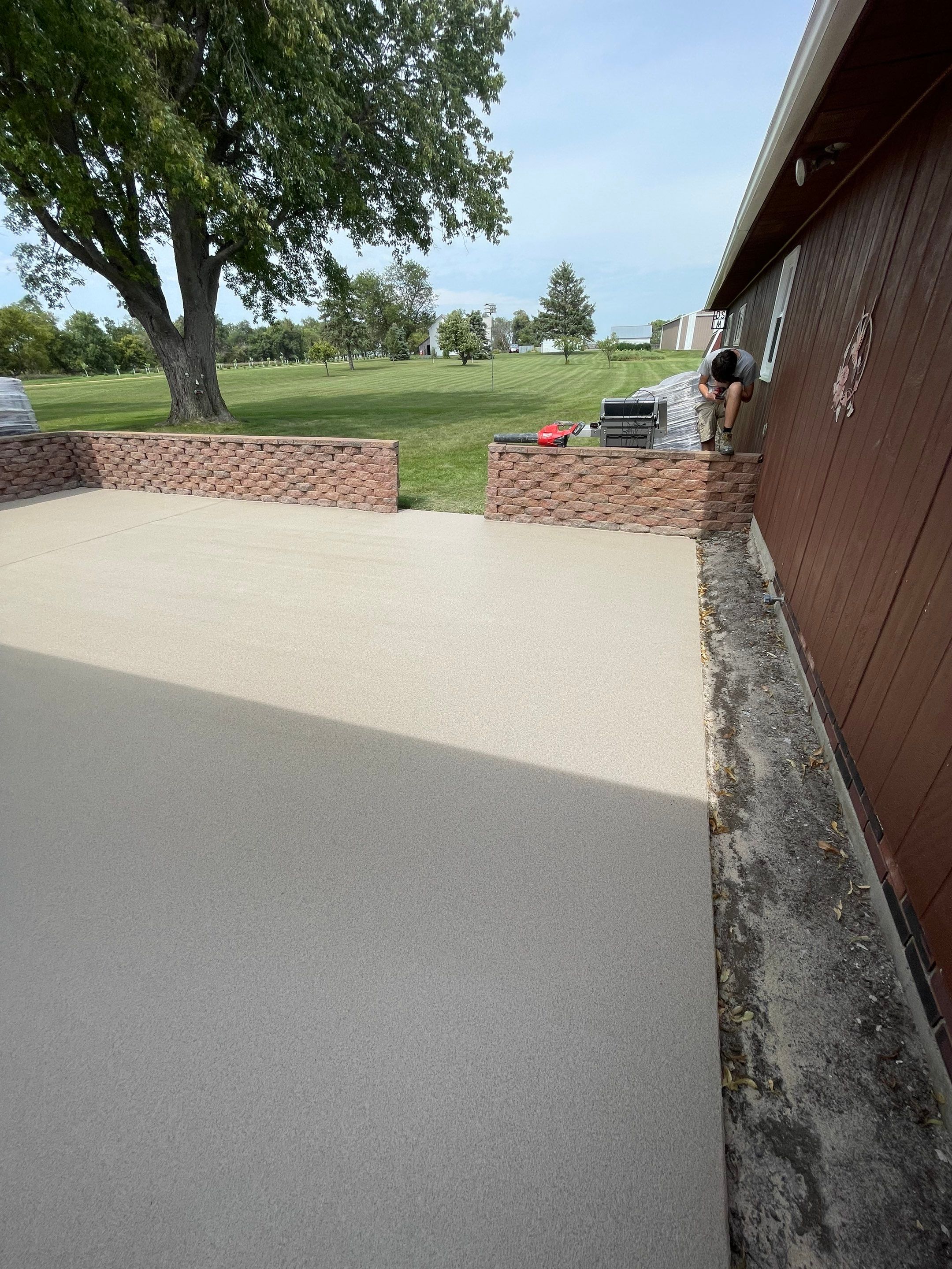 Concrete Patio Resurfacing and Protective Coating in Winfred, South Dakota by Select Painting, Coatings & Garage Cabinets