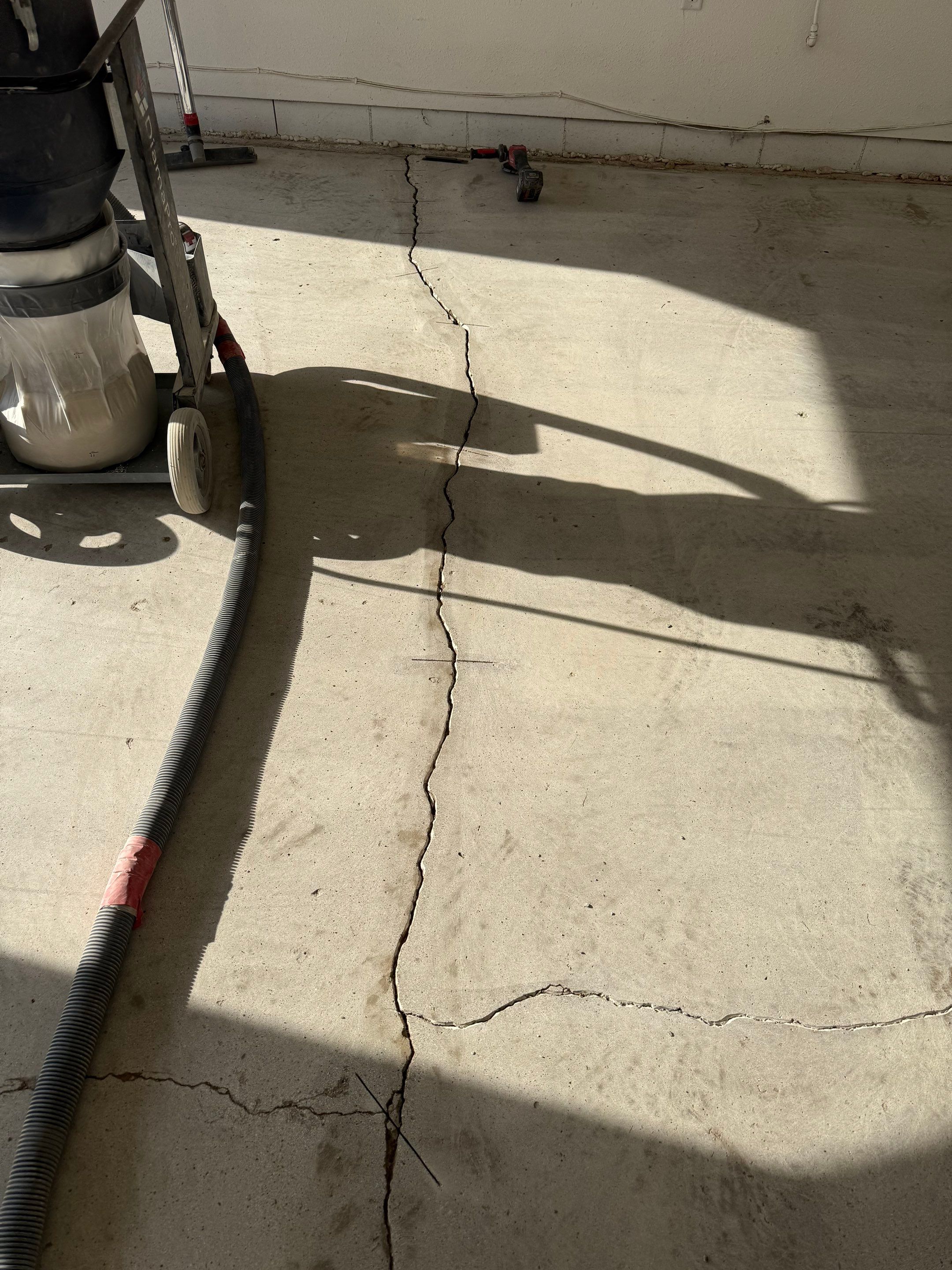 Feather Grey Garage Floor Coating and Crack Repair in Beresford by Select Painting, Coatings & Garage Cabinets