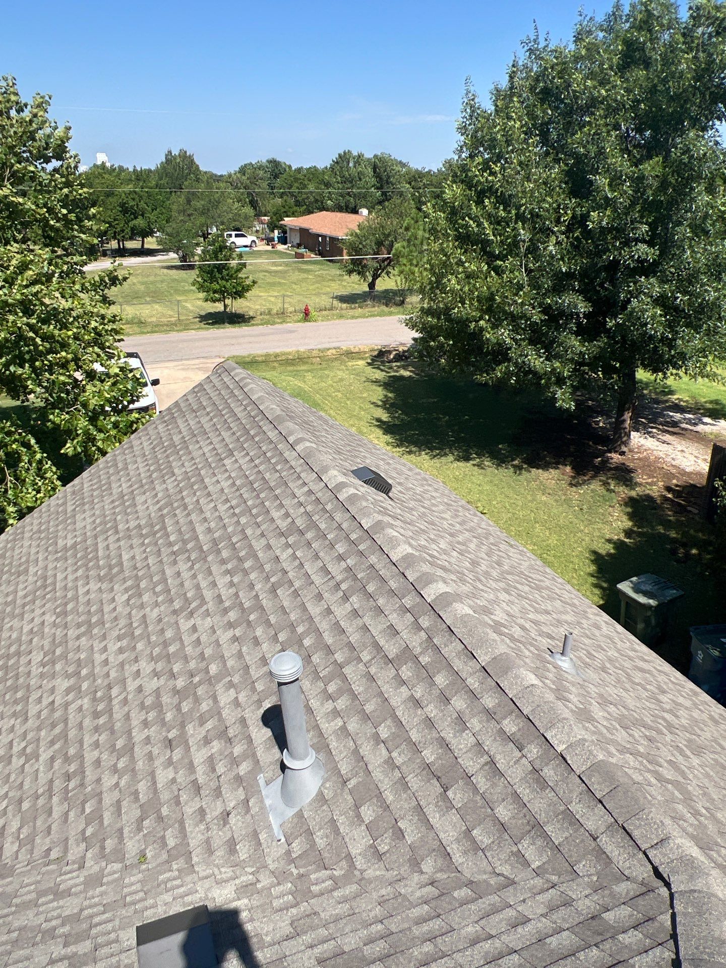 Roof Replacement and Gutter Installation in Edmond, OK by McCann's Roofing and Construction