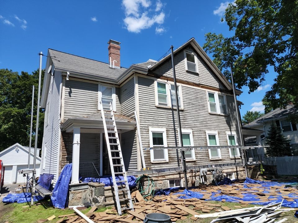 Vinyl siding layover project for 2 family in Wellesley, MA by UBrothers Construction