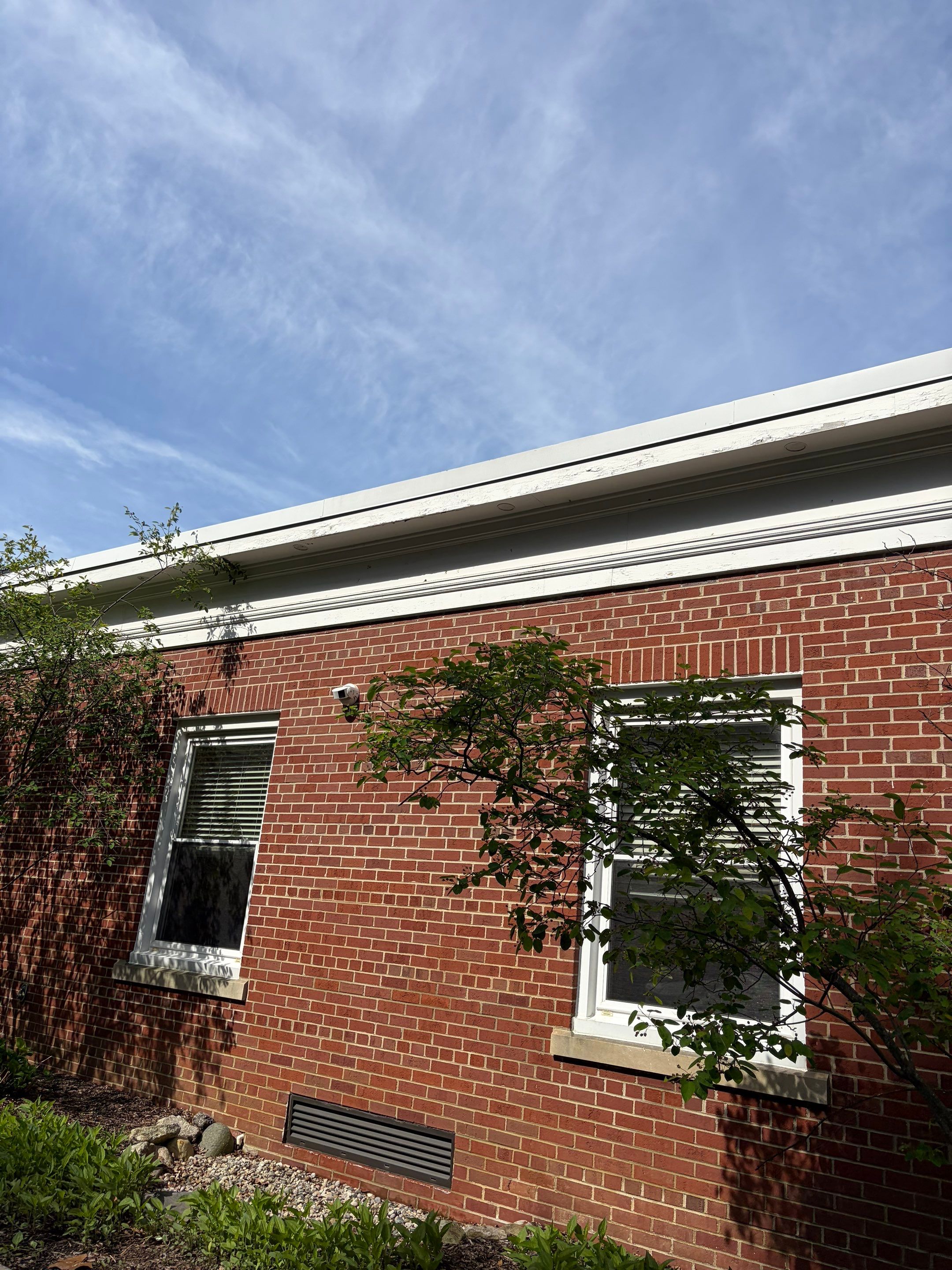 Commercial Wood Trim Restoration and Gutter Replacement in Birmingham by Top Shelf Painter