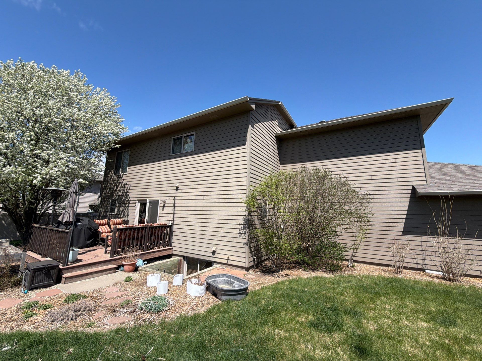 Residential Exterior Painting with Shutter and Trim Updates in Sioux Falls by Select Painting, Coatings & Garage Cabinets