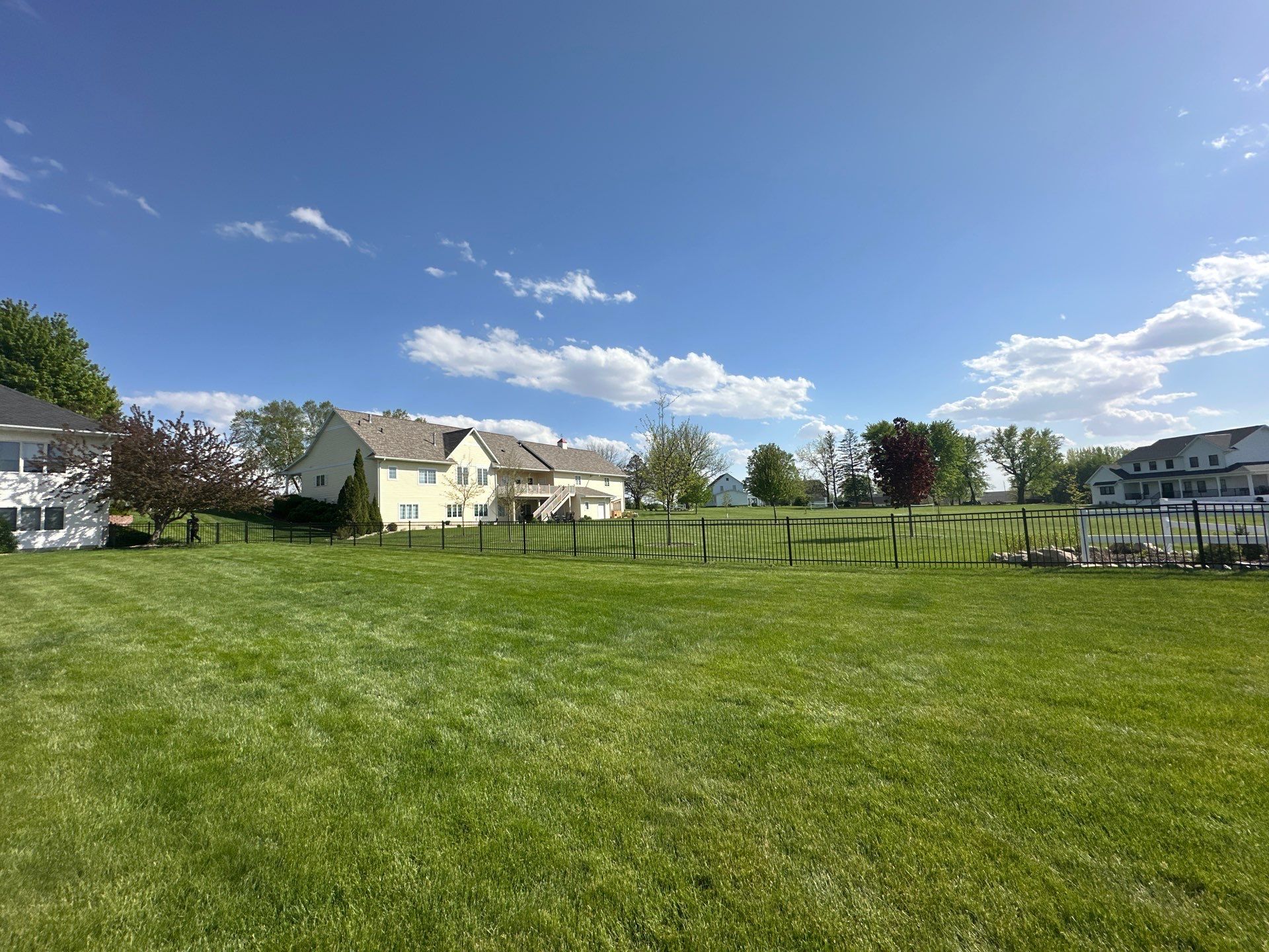 Black Ornamental Metal Picket Fence Installation in Waterloo by Perfect Picket Fence and Stain