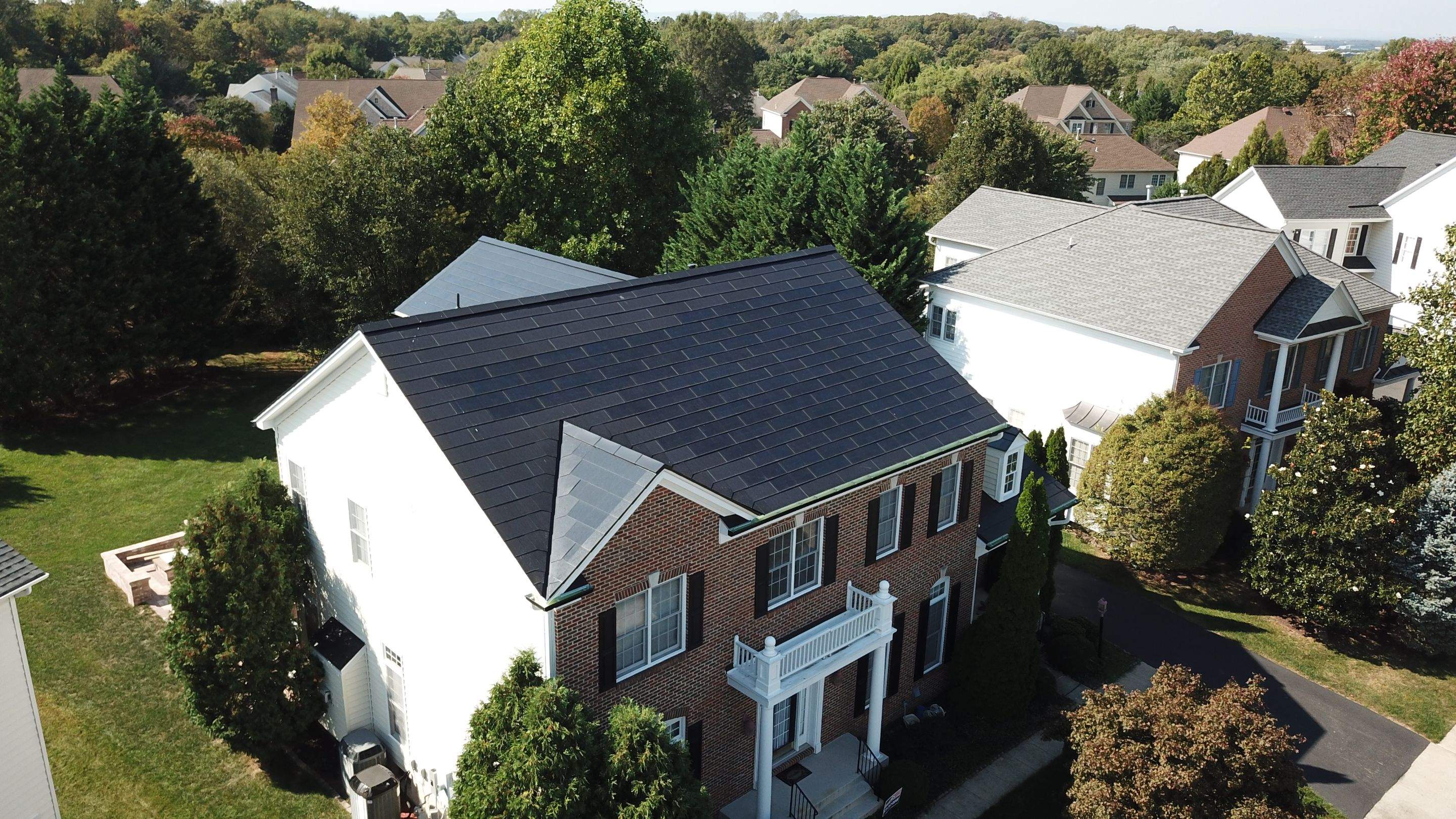 Tesla Solar Roof Replacement using Tesla Solar Roof V3 tiles by American Home Contractors