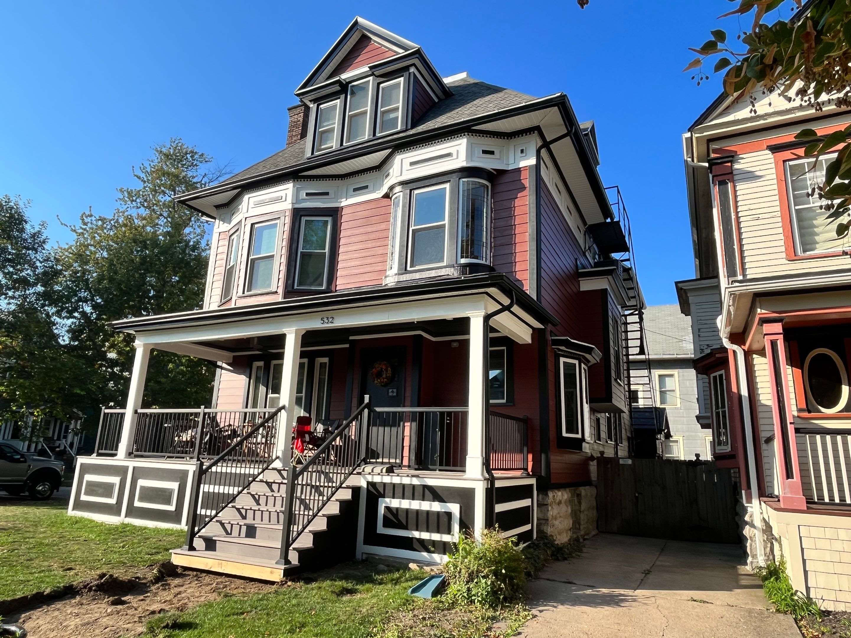 Exterior Renovations- Siding, Stamped Concrete, Porch, and Railings by Ivy Lea Construction