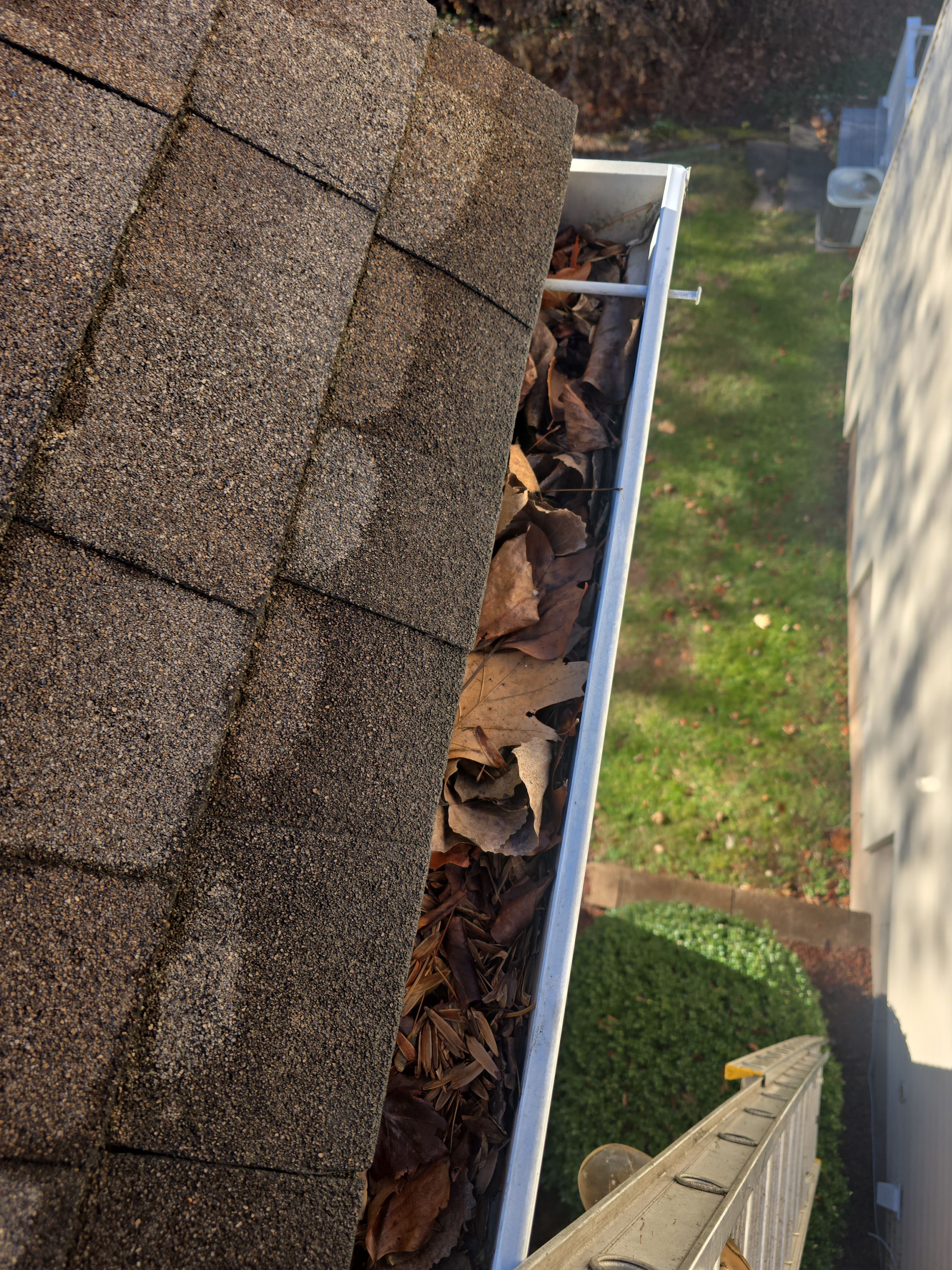 Commercial gutter cleaning Hartford, CT before photo with filled gutters