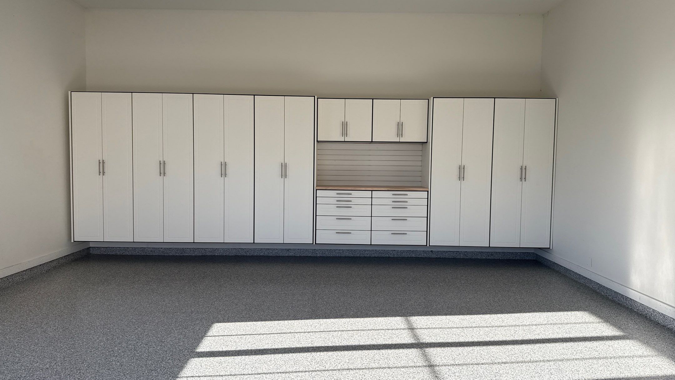 Garage Remodel with Custom Cabinets and Epoxy Floors in Overland Park by Banner Garage