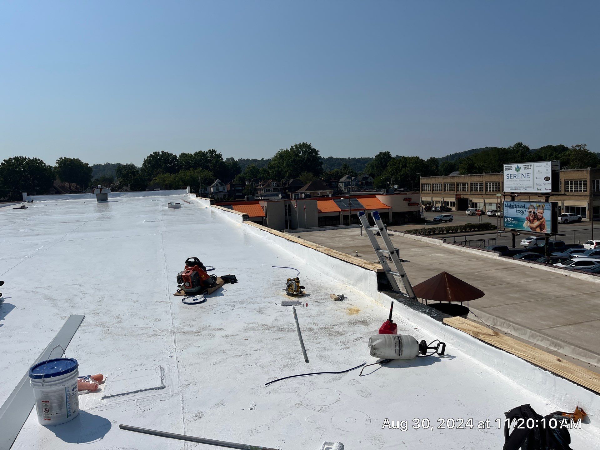 Commercial Roofing Installation using smartcoat Roof coating by Fahey Roofing + Contracting