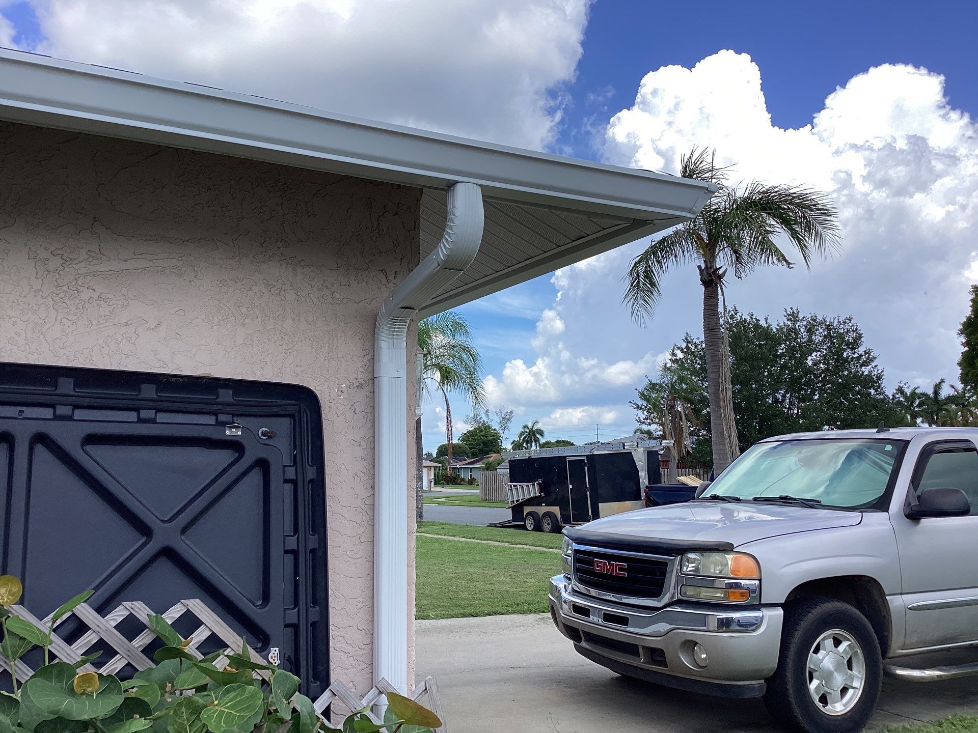 White Seamless Gutters and Splash Guards in Fort Myers FL by Gutter Professor by Gutter Professors