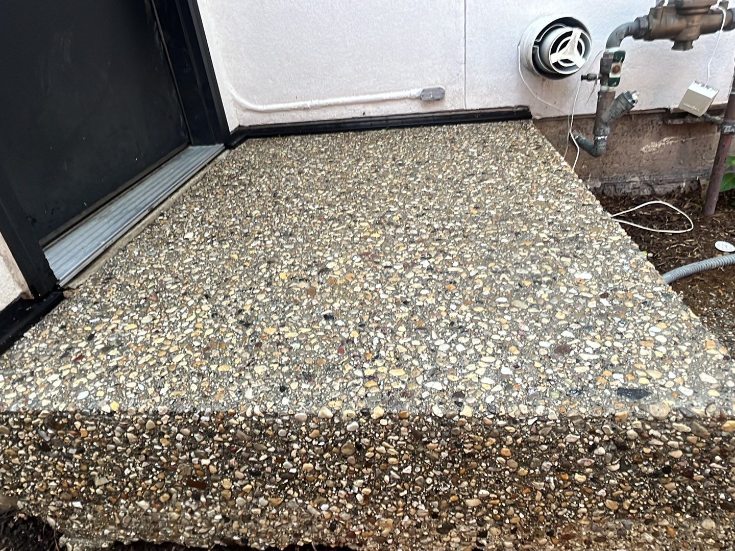 Aggregate concrete cleaning and sealing using Surebond SB-9000 by Northern Power Washing LLC.