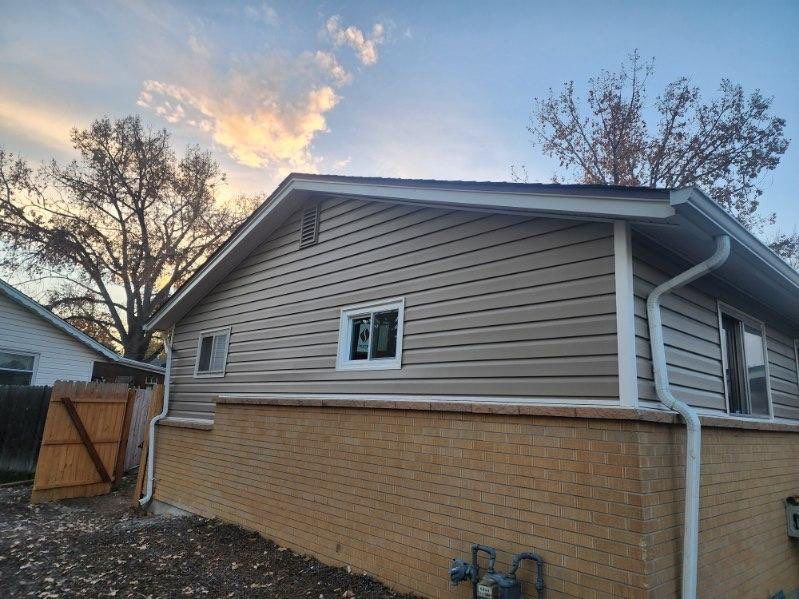 Vinyl siding installation  by United Windows and Siding LLC