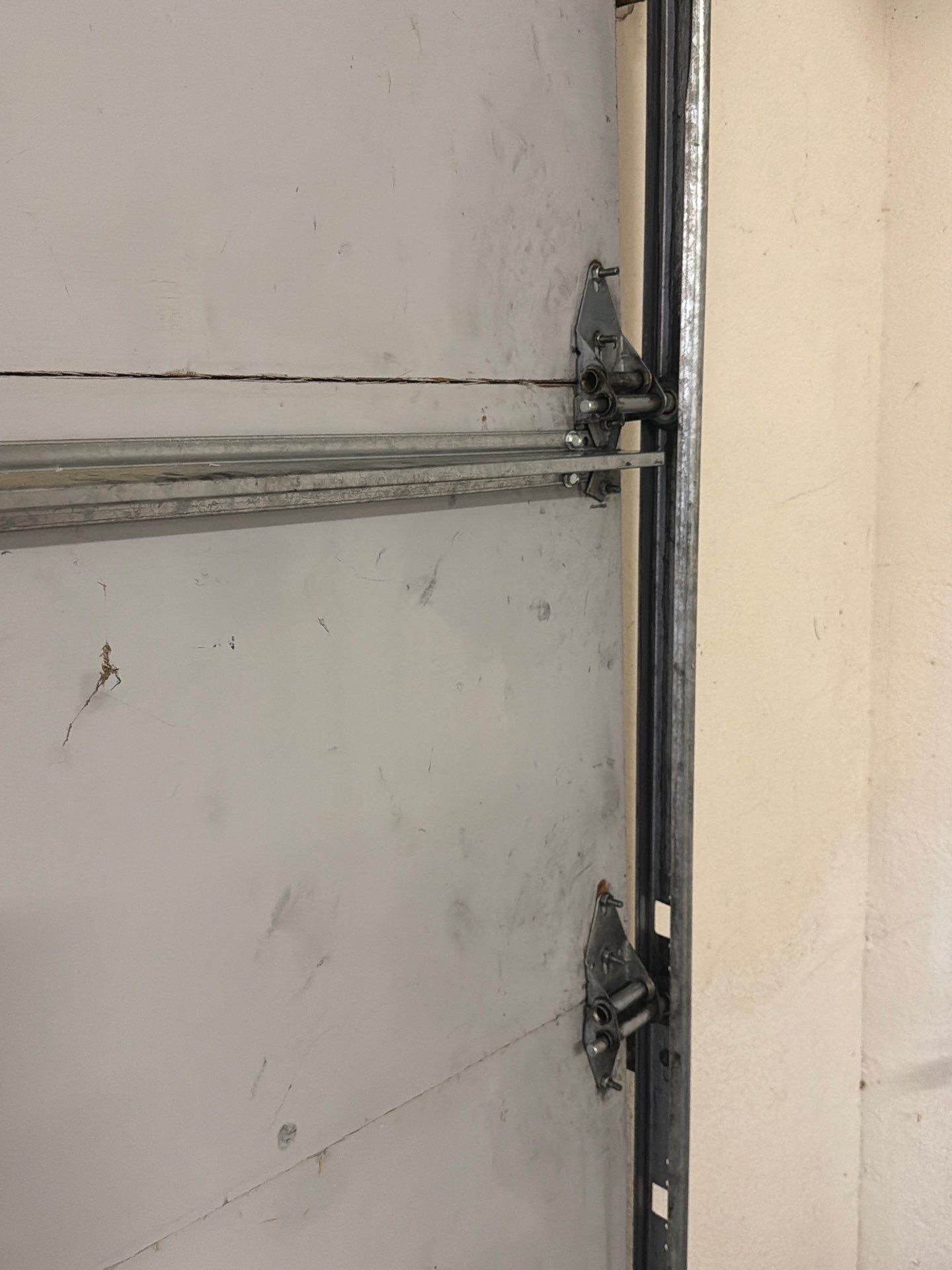 Sectional Garage Door Torsion Spring Replacement and Hardware Service by Valiant Garage Door