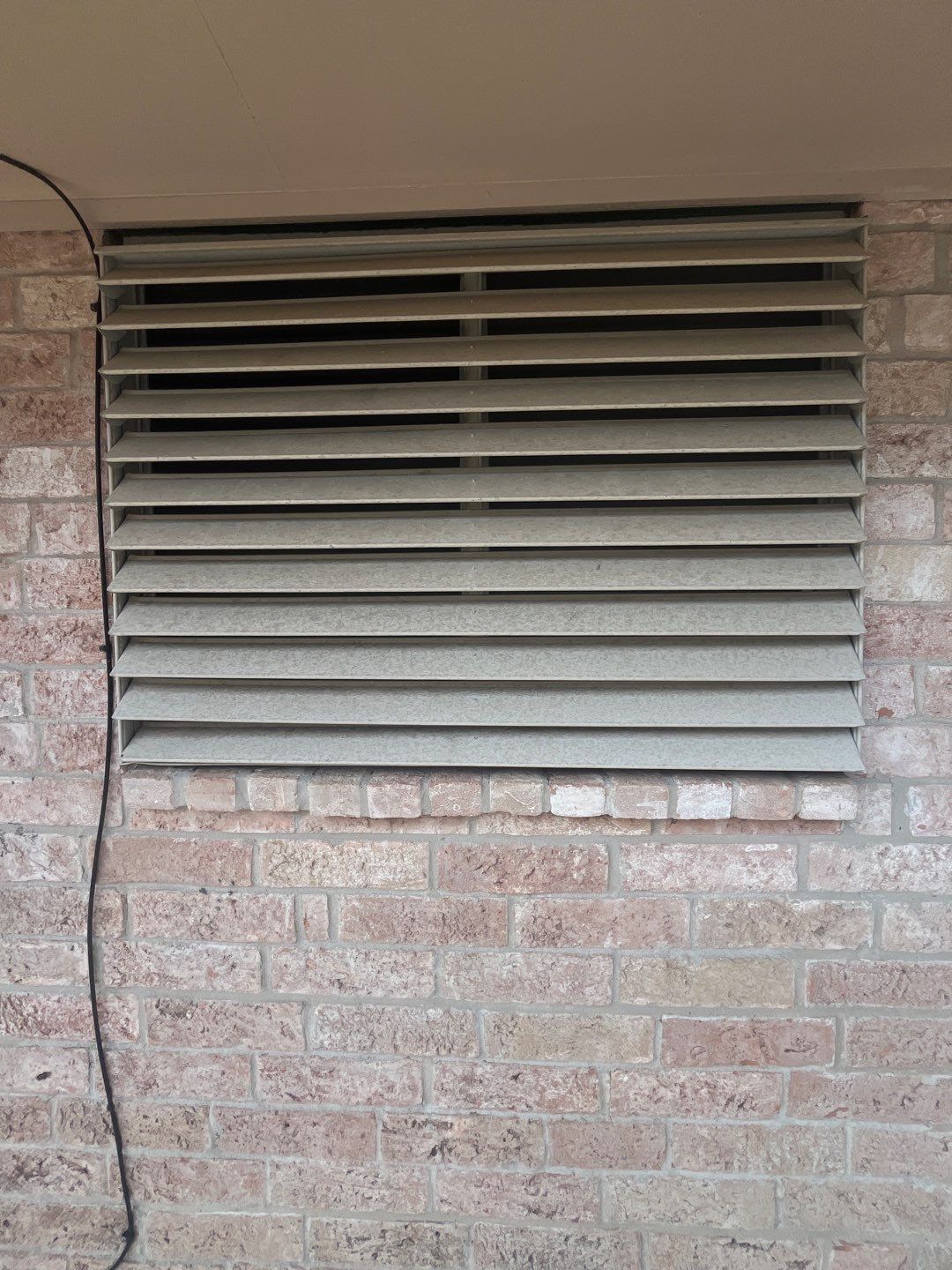 Colored Vinyl Windows to blend into brick by Bayfront Roofing and Construction
