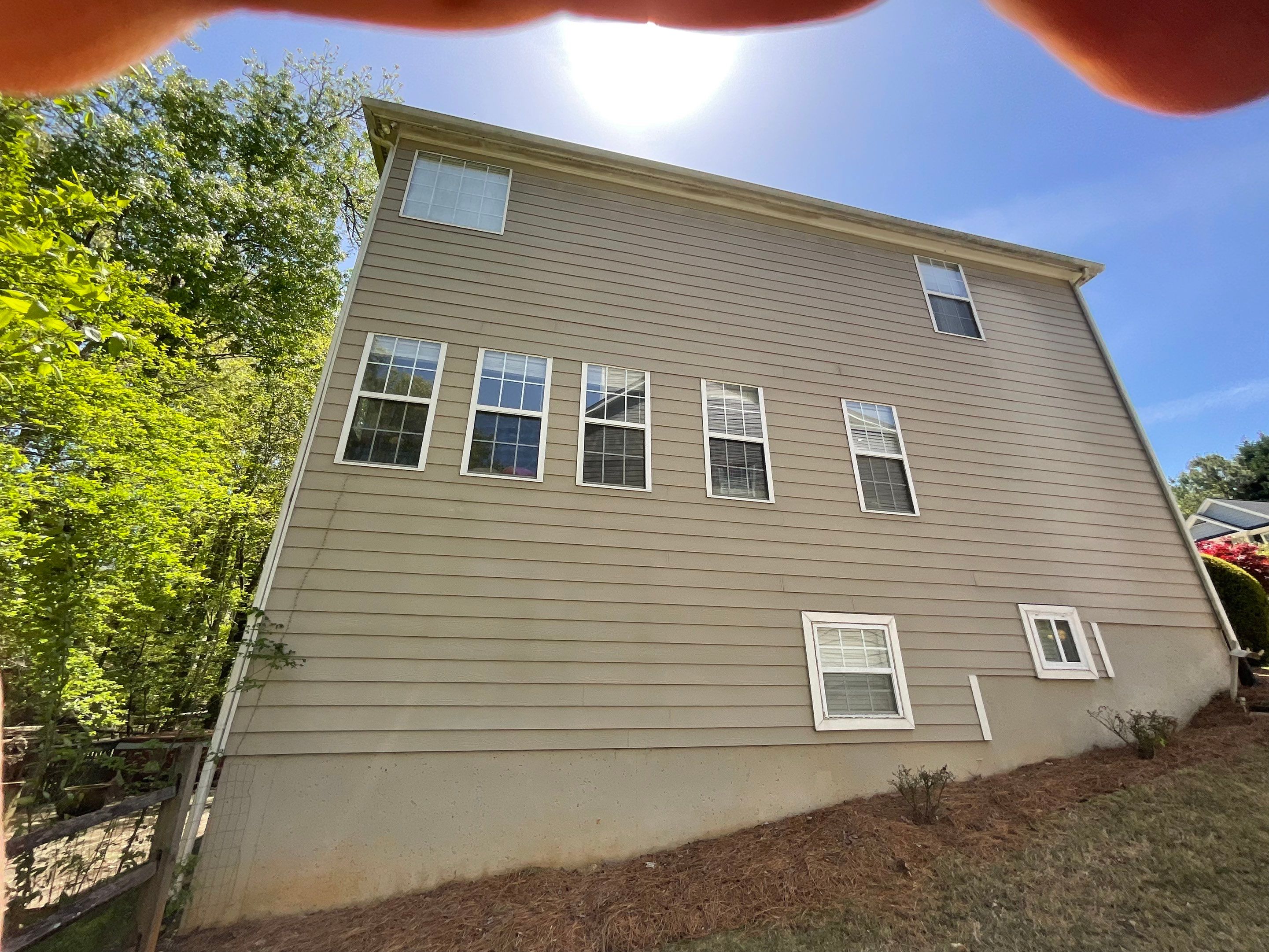 Stucco and Siding Exterior Painting with New Gutters in Kennesaw by Swift Home Renovations