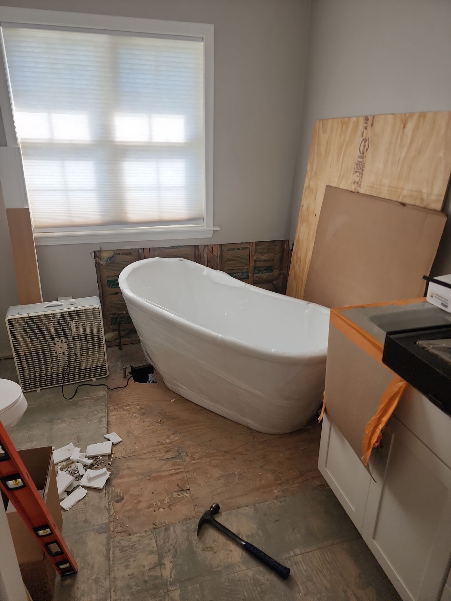 Master Bathroom Renovation Featuring Dark Textured Shower Panels in Branson West by Kitchen Works LLC