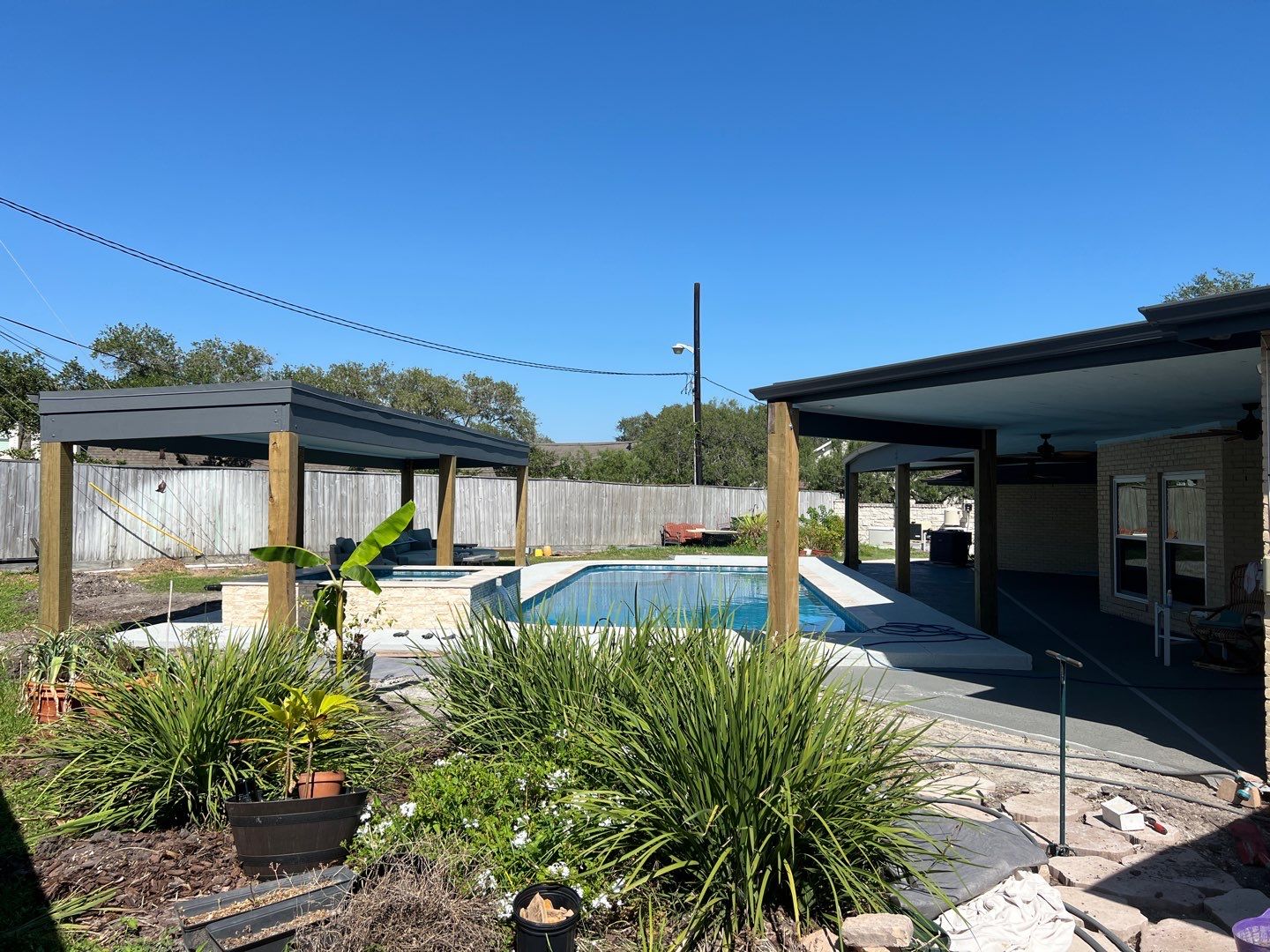 Beautiful pool side build by Bayfront Roofing and Construction