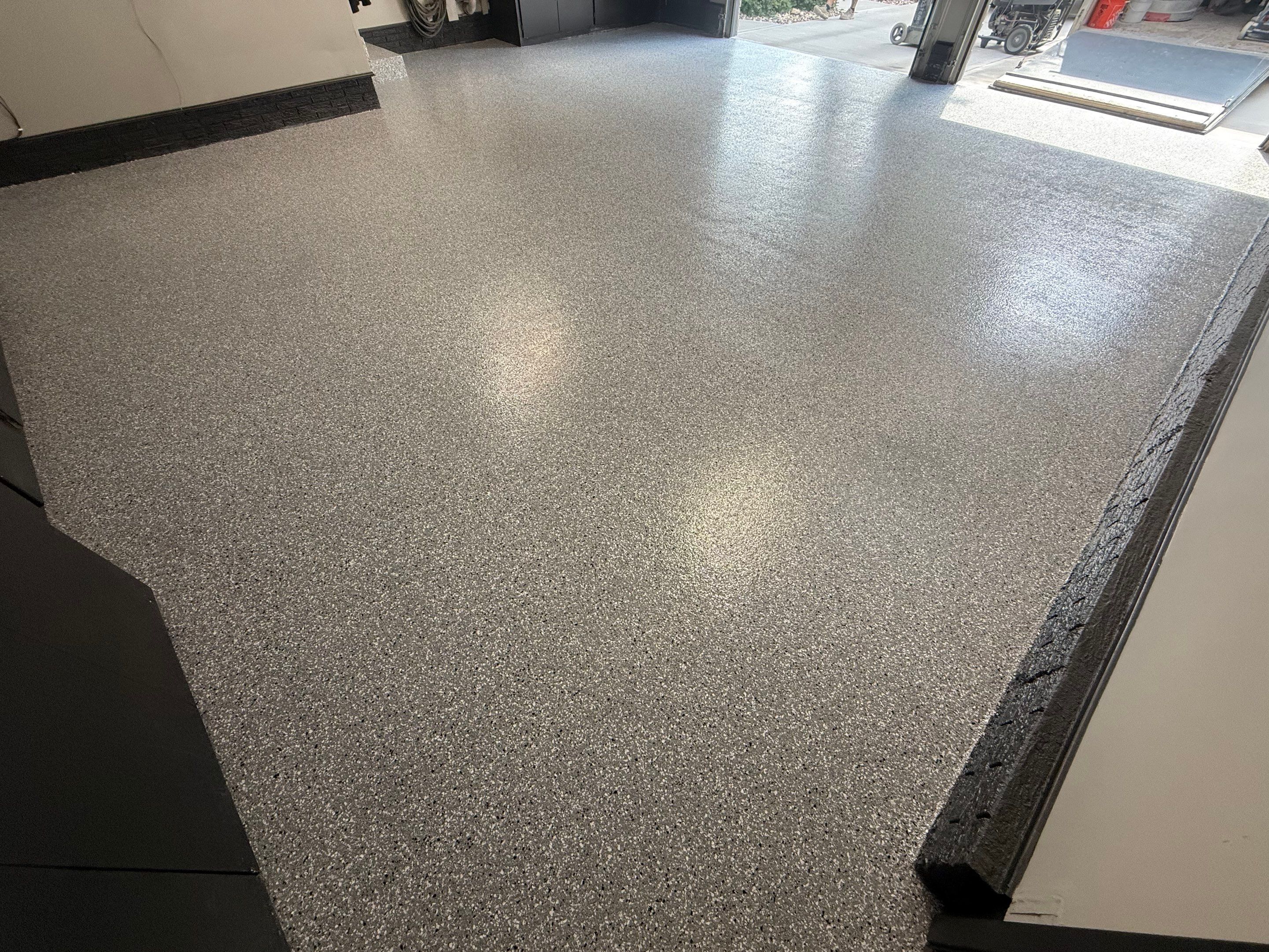 Garage Floor and Textured Pool Deck Coating in Sioux Falls by Select Painting, Coatings & Garage Cabinets