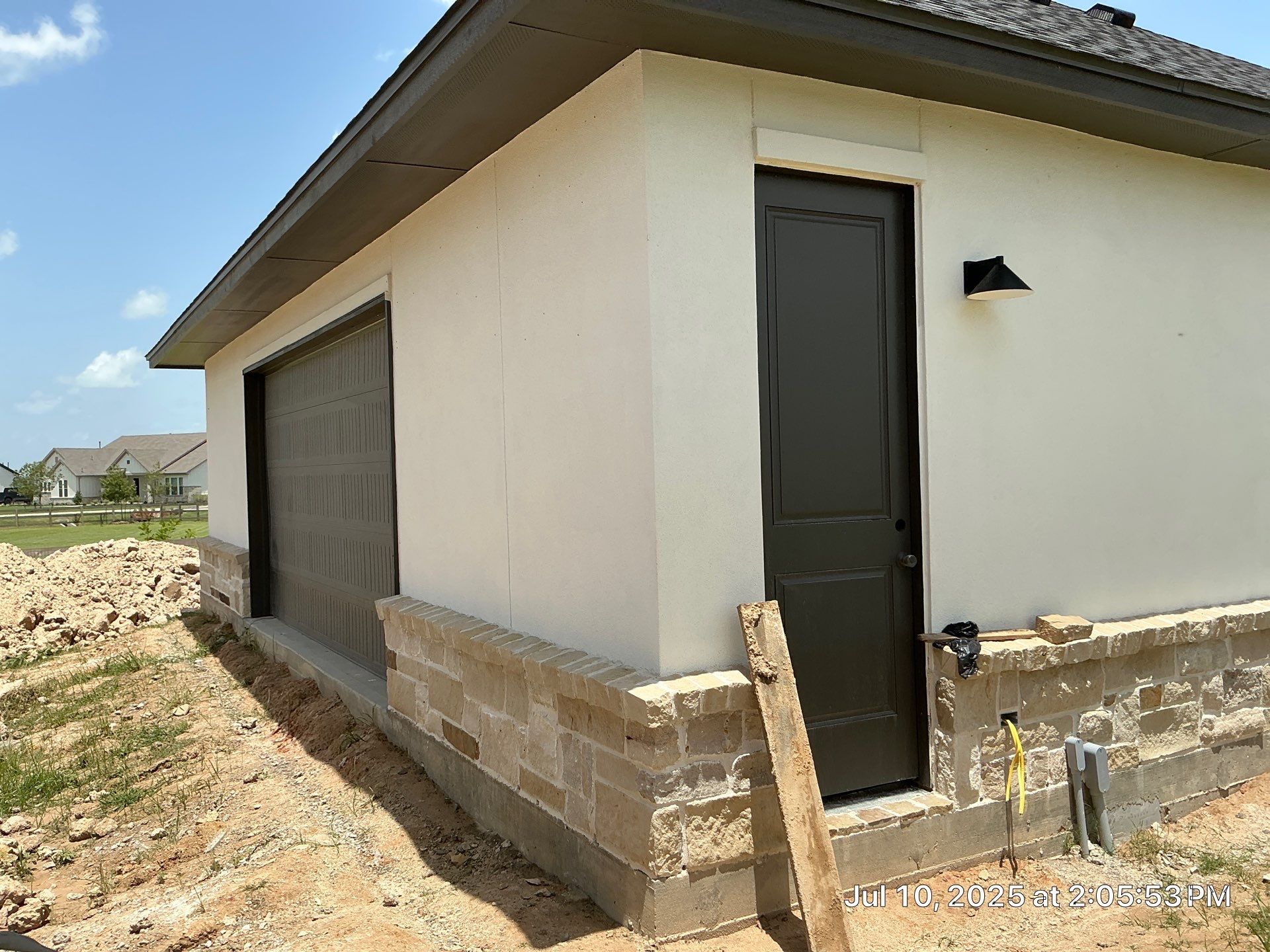 Waller Estate Elegance: Apex Stucco with Grand Stone Accents by Apex Conventional Stucco Llc