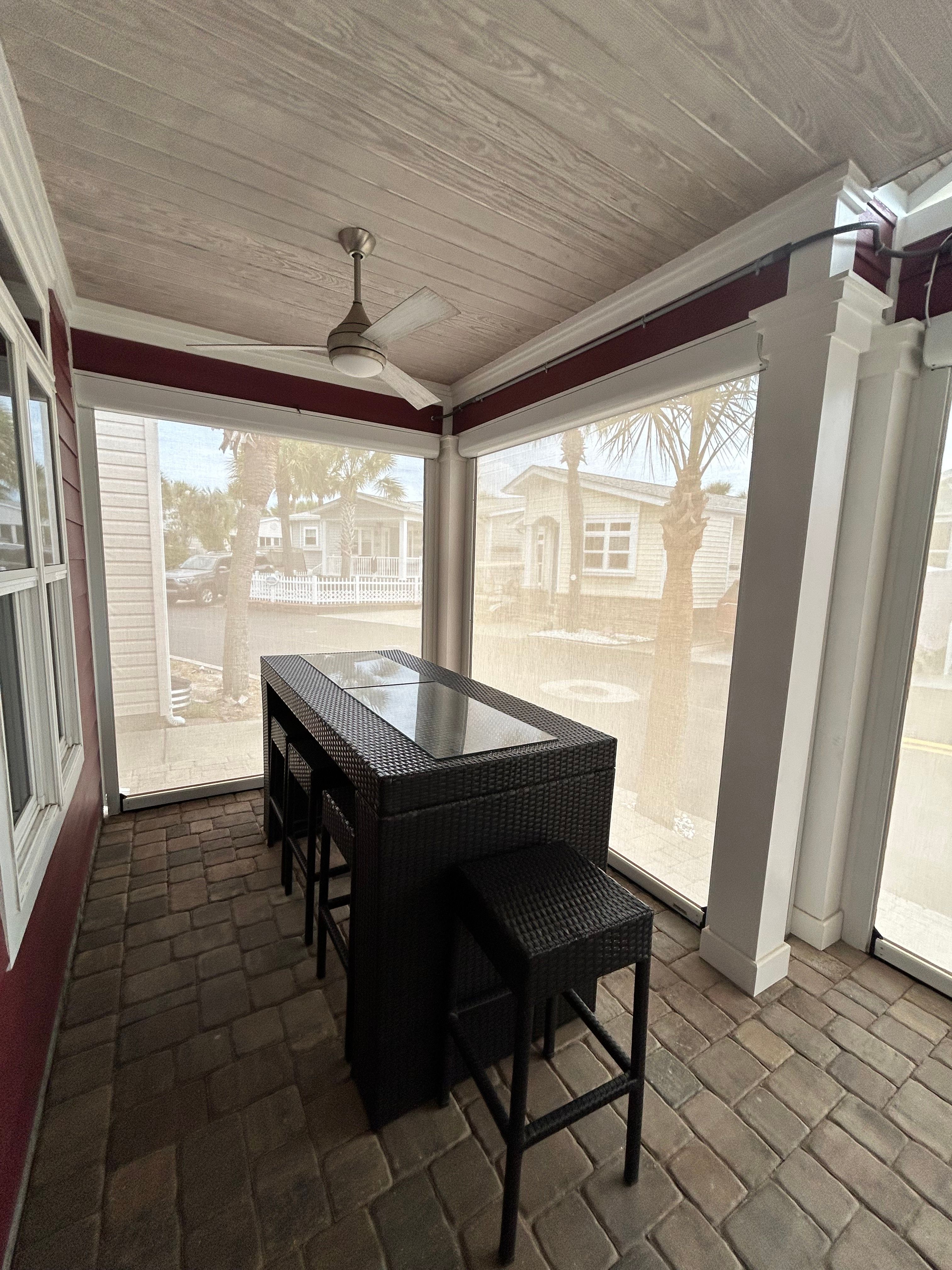 Fenetex Motorized Screen and Hurricane Shutter Installation in Panama City Beach by Brannan Aluminum Inc.