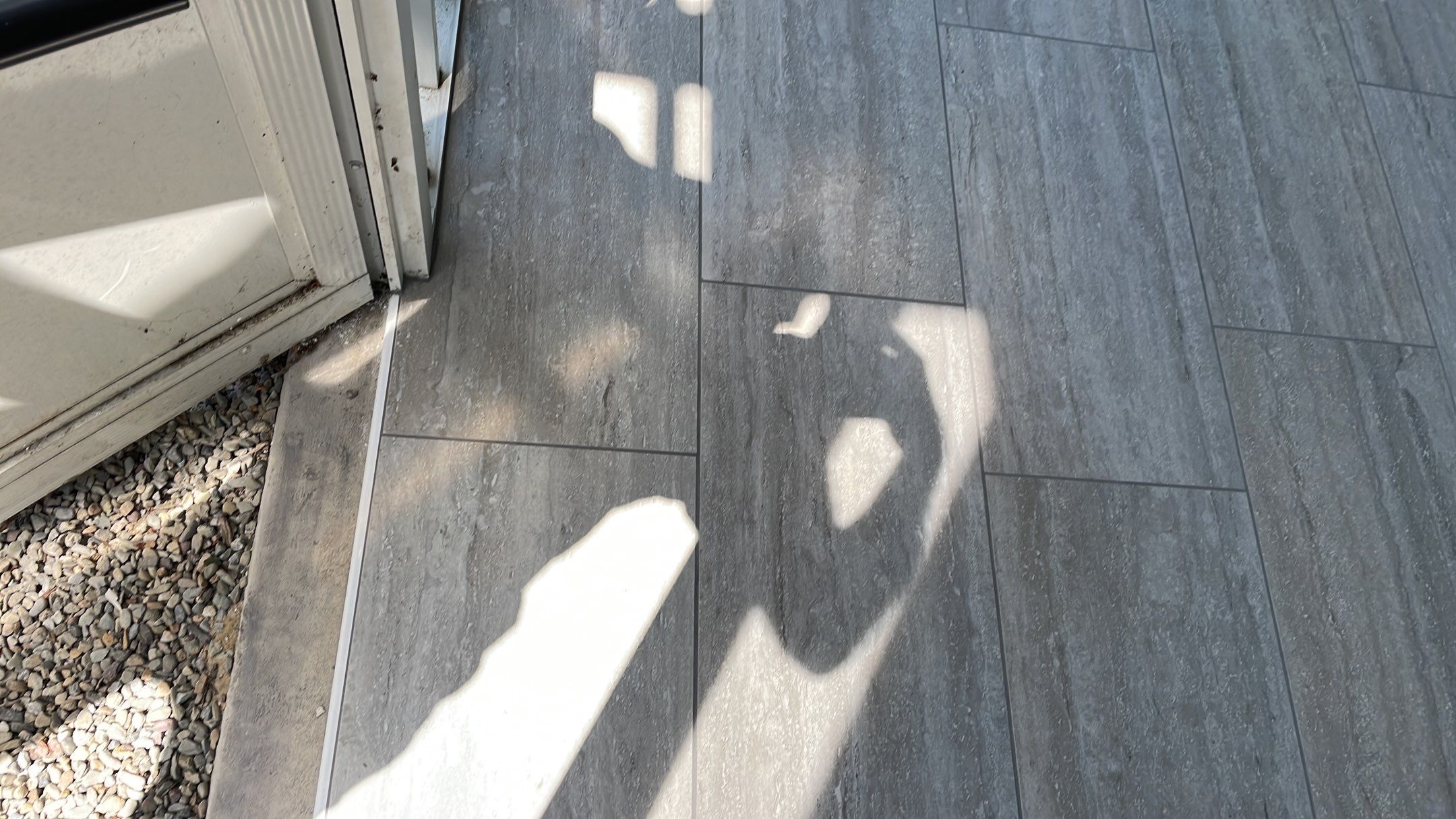 Sunroom using 12x24 tiles by Footprints Floors of Coastal Carolina