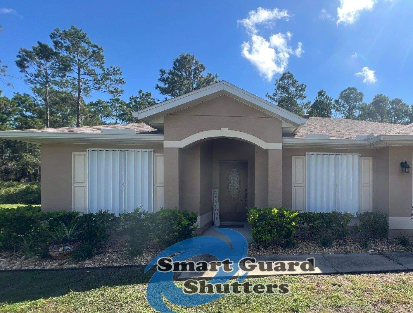 Accordion Shutters in White by Smart Guard Shutters