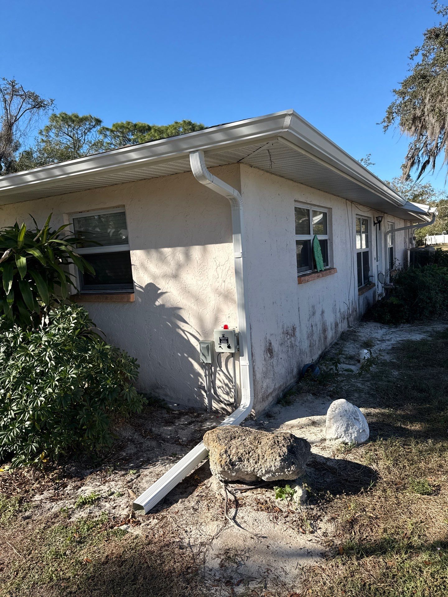 Downspout Installation using White Down Spouts in Sarasota FL by Gutter Professors