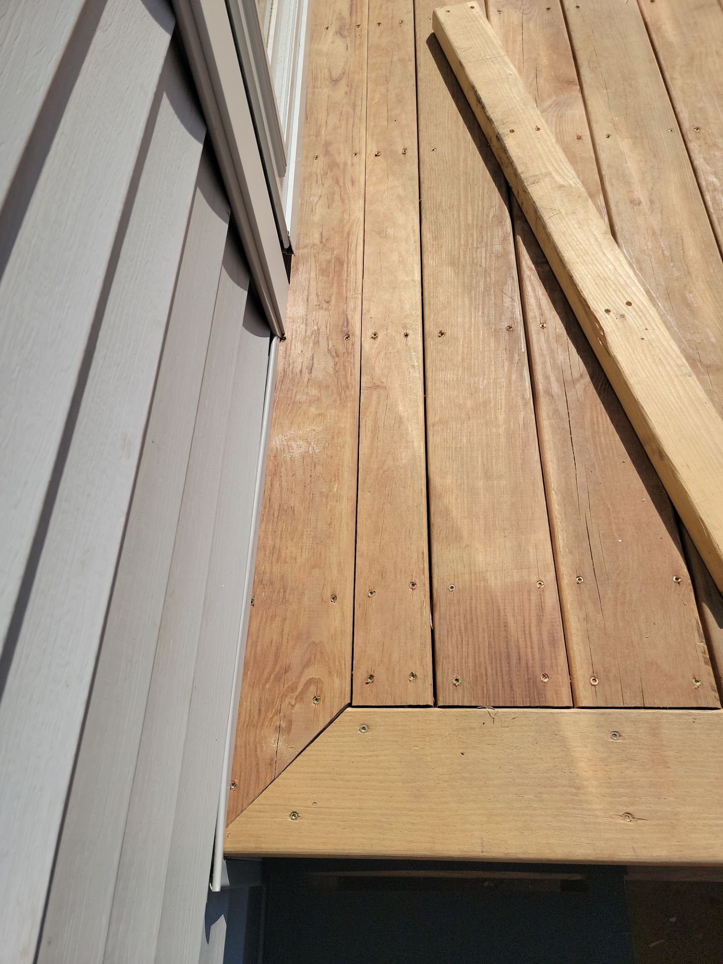 TREATED LUMBER DECK  by Avalon Roofing and Exteriors