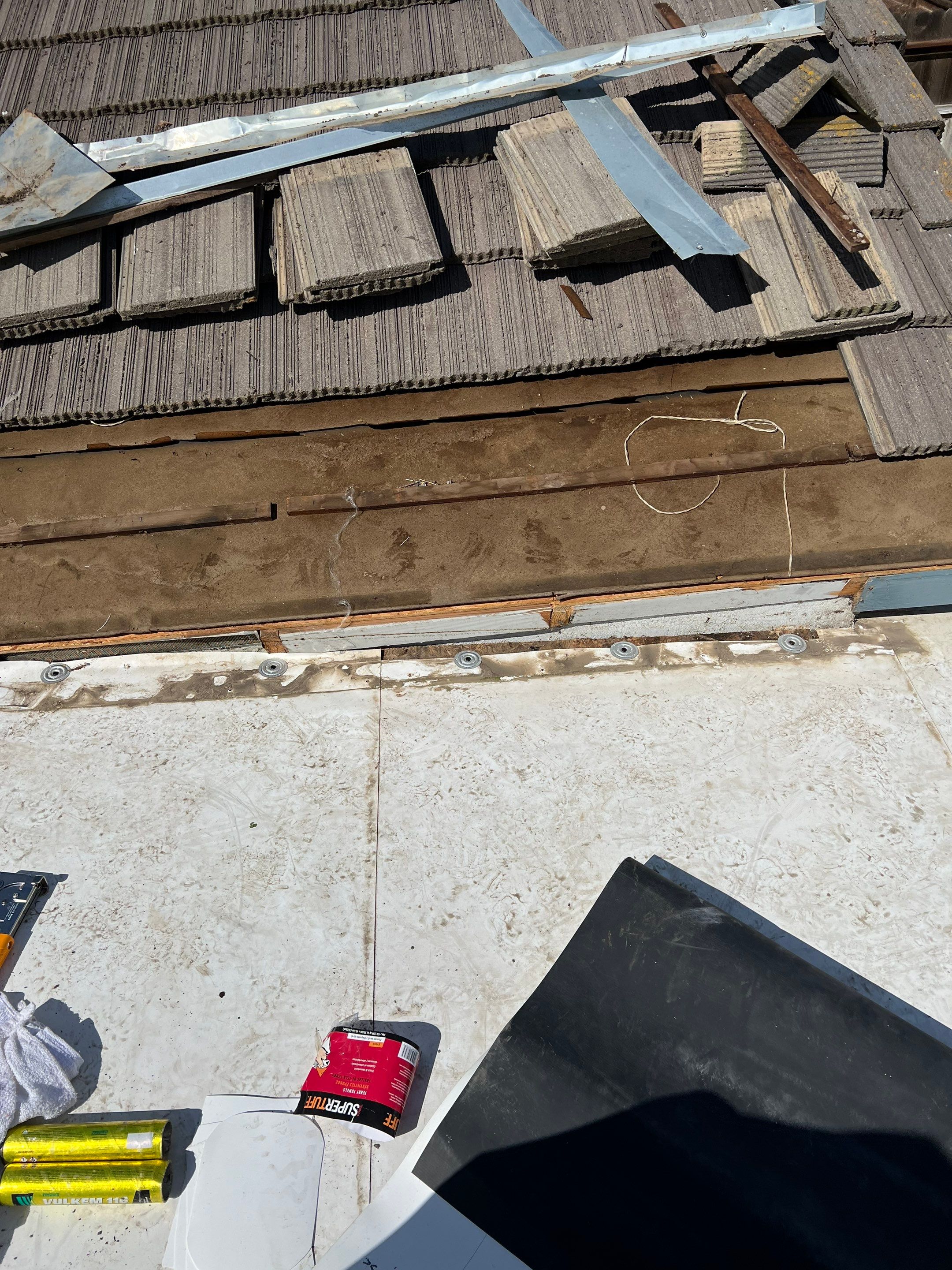 Single-ply roofing system on porch using TPO 60 mil by Straight Edge Roofing Inc