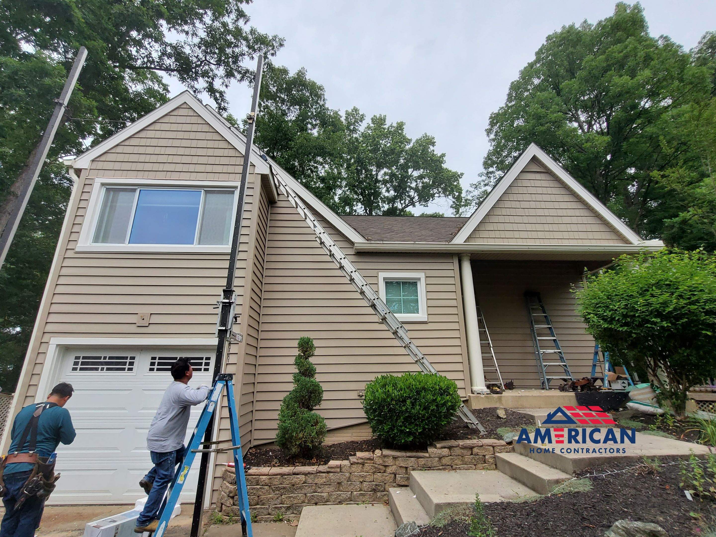 Mastic Siding + Interstate Windows by American Home Contractors