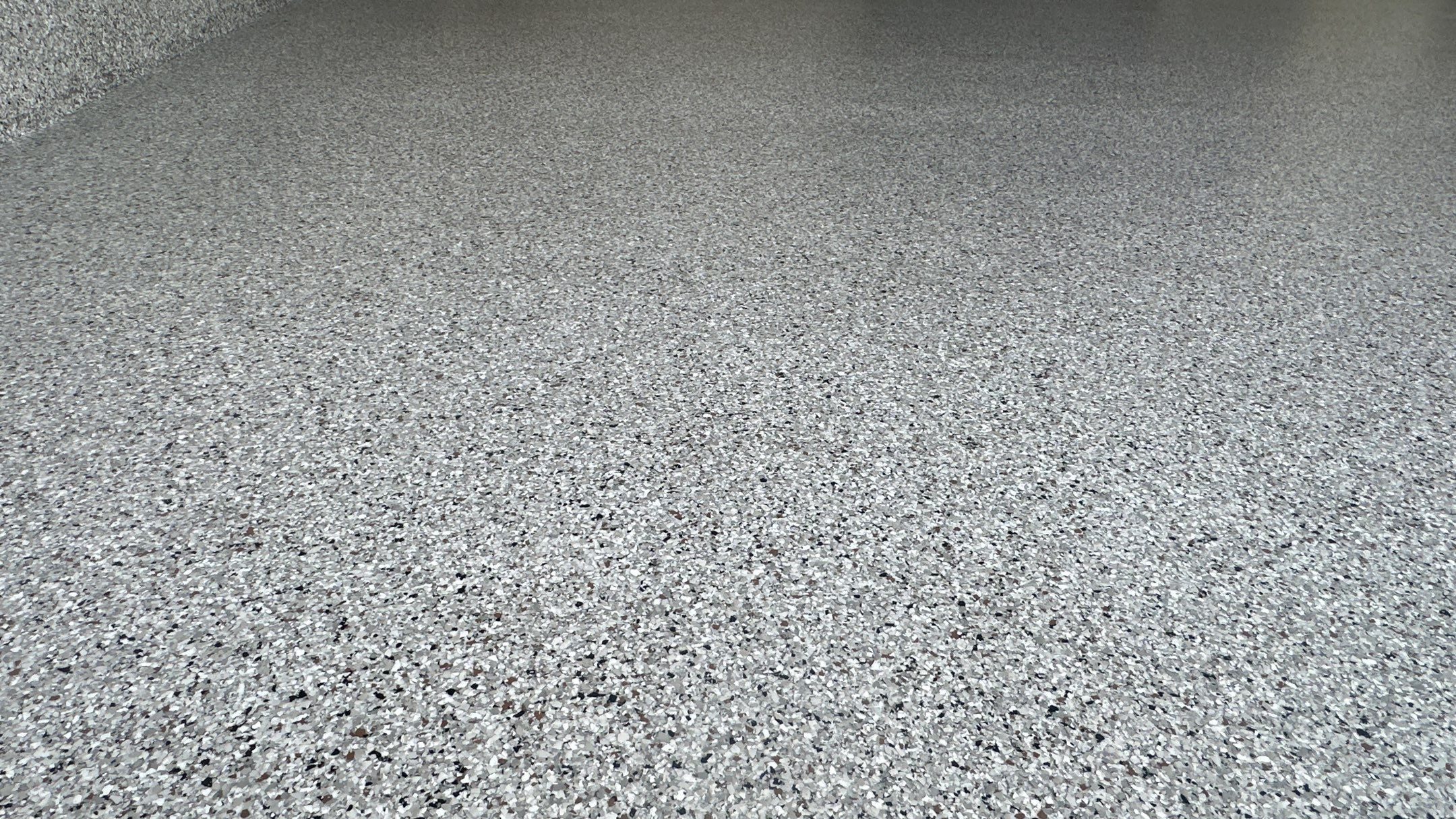 Megan J. added cabinets and slotwall to her garage. Plus a New Floor by Banner Garage