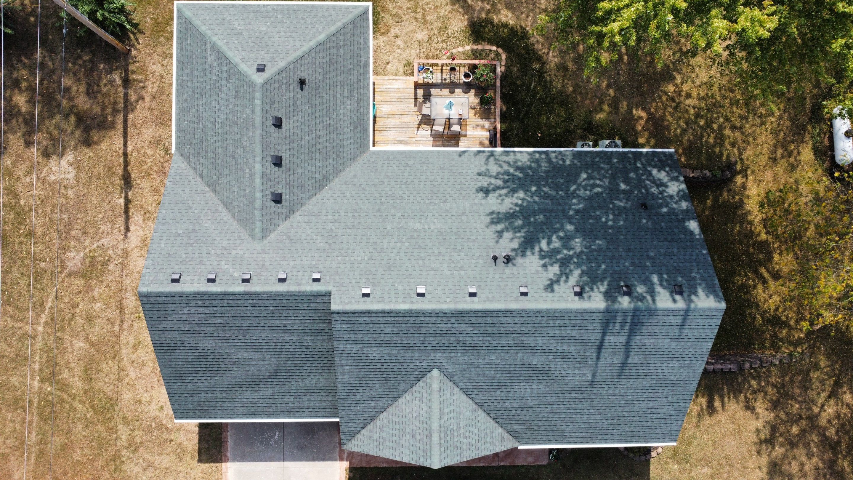 Residential Roofing Install - Green Atlas Pinnacle Pristine Shingles - White Gutters & Downspouts by Titan Commercial & Residential Roofing