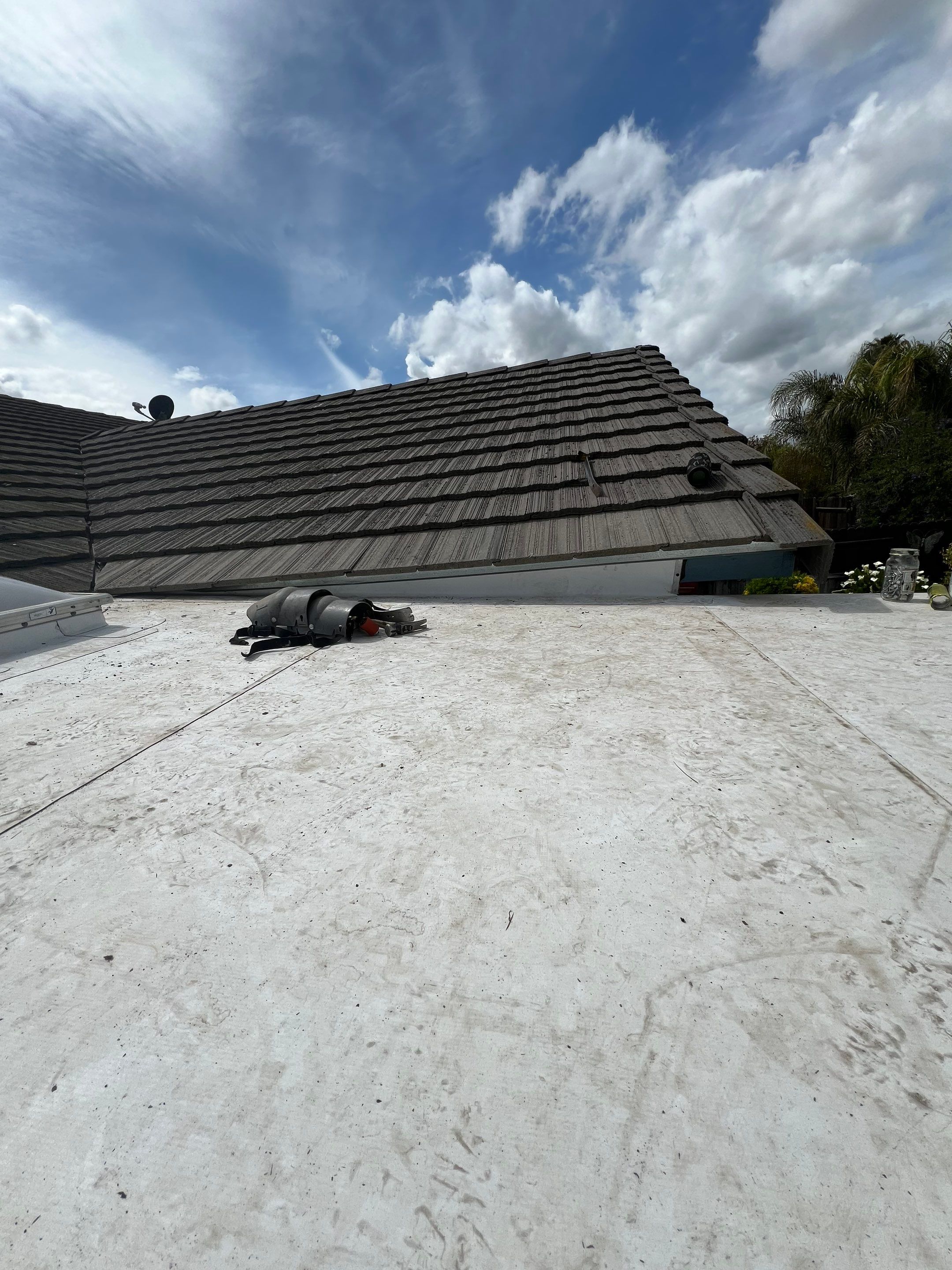 Single-ply roofing system on porch using TPO 60 mil by Straight Edge Roofing Inc