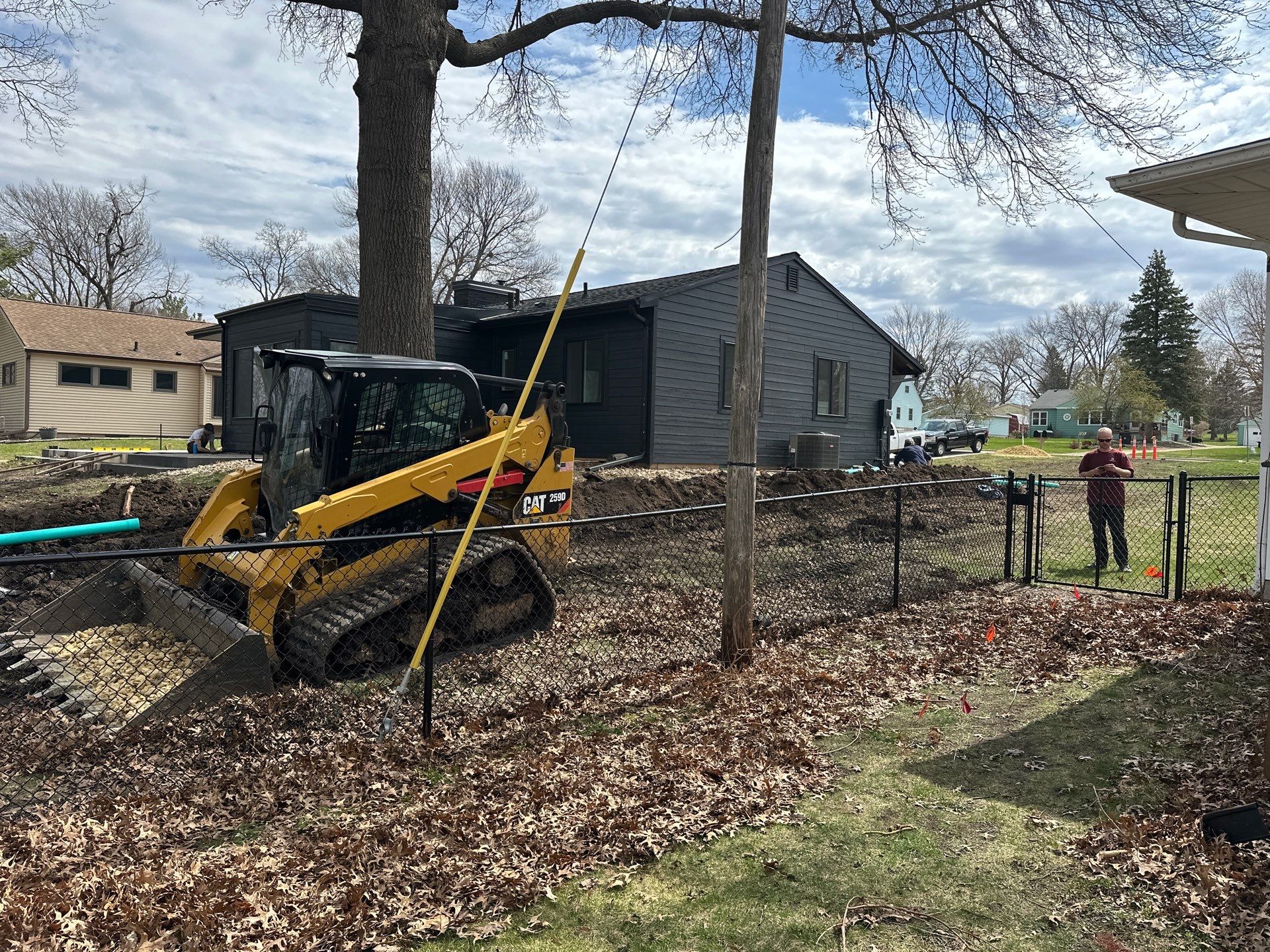 Black Vinyl-Coated Chain Link Fence Installation in Cedar Falls by Perfect Picket Fence and Stain