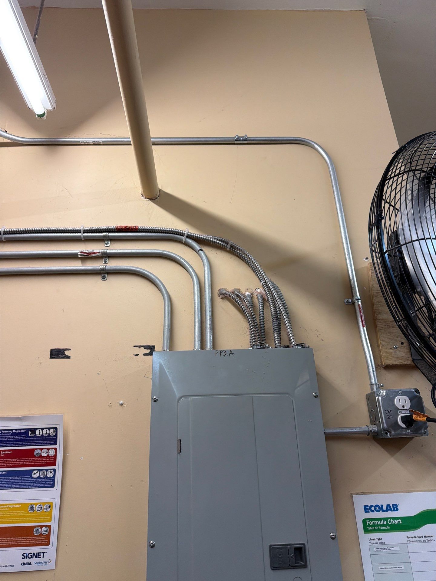 Commercial Laundry Room Outlet & Fluorescent Light Wiring by Spartan Home Pros