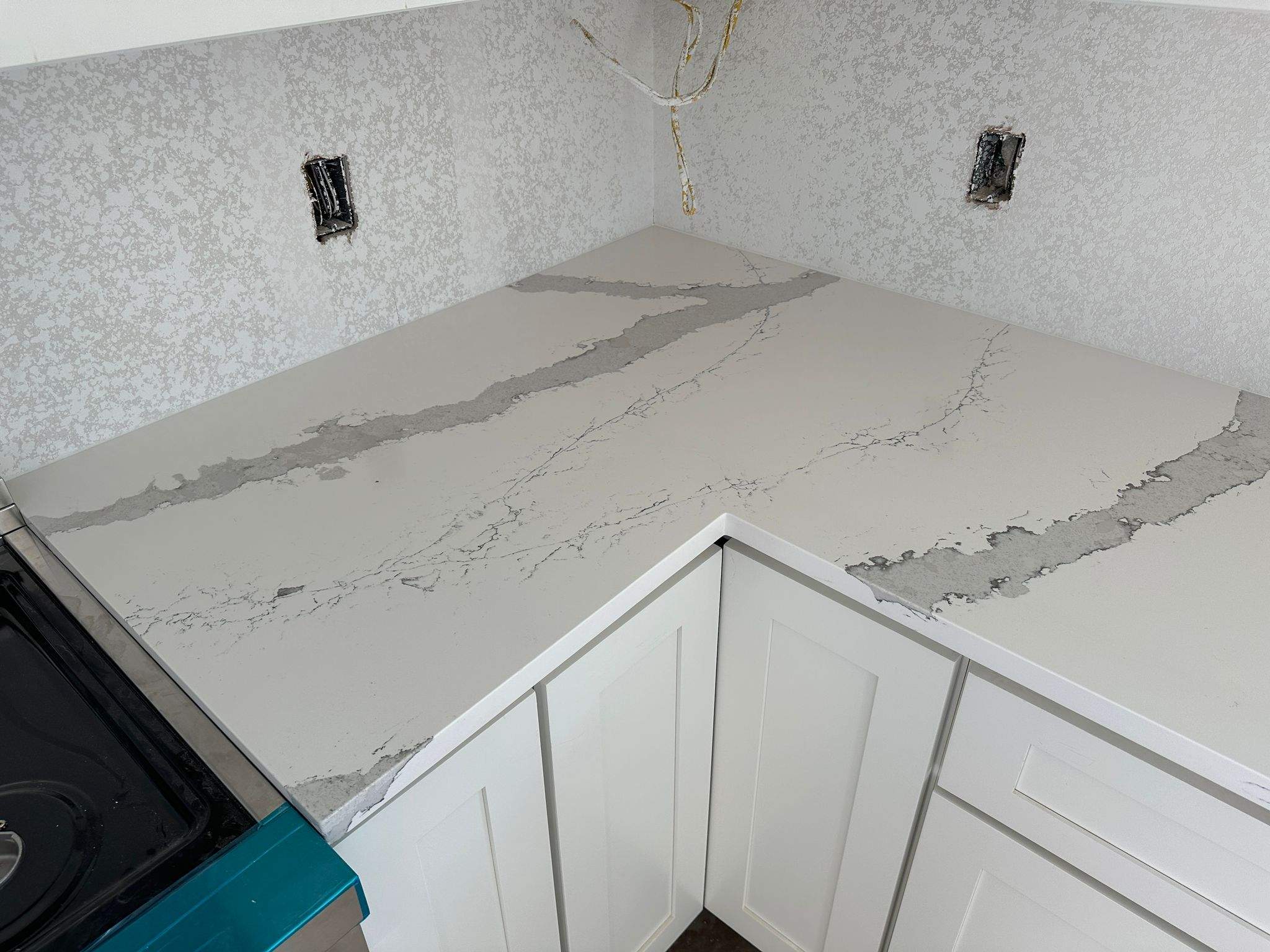 Kitchen and Bathroom Countertop Upgrades Featuring Gray Veined Quartz by Mena stone surfaces